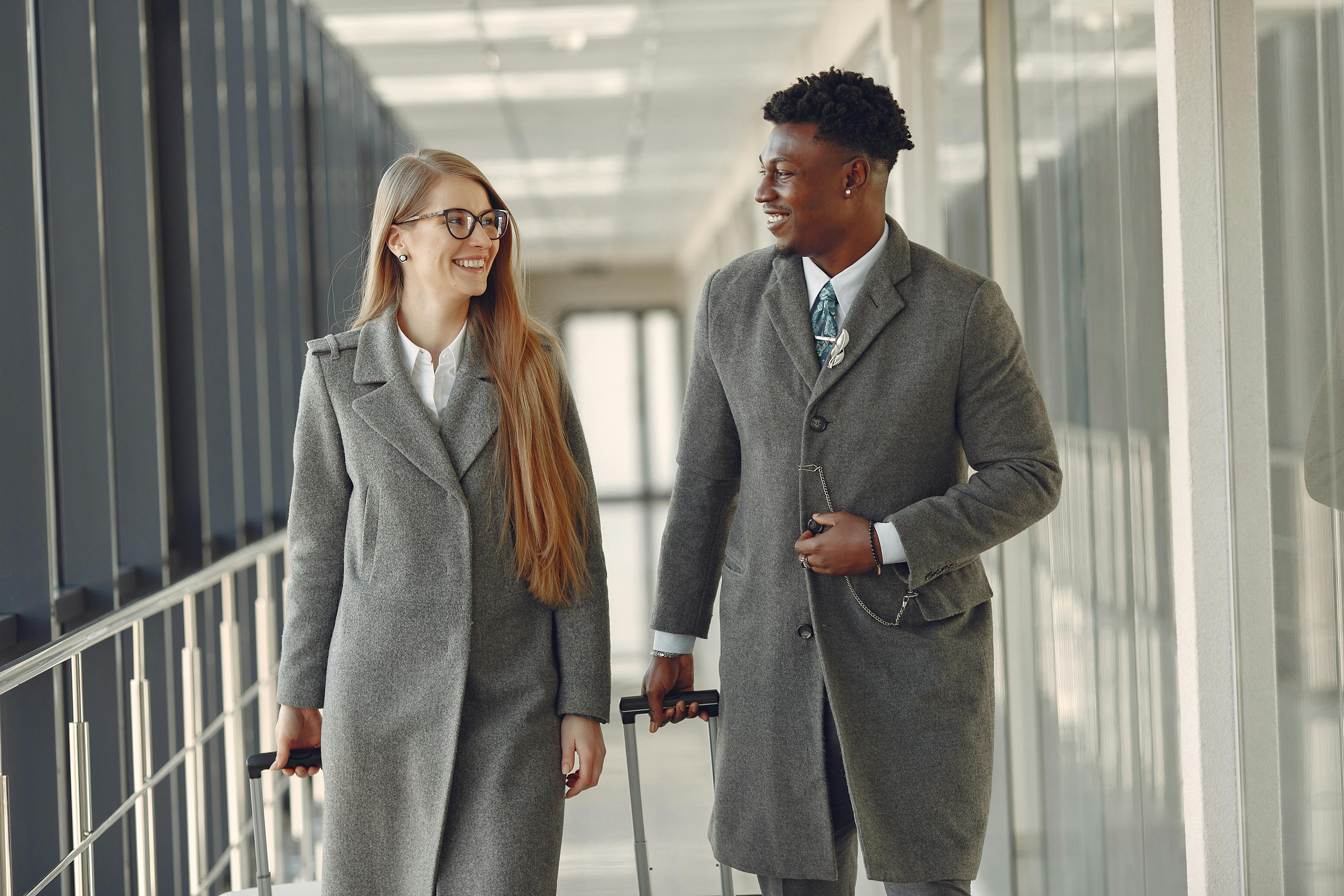 A woman and man having a conversation in an airport walkway | Source: Pexels