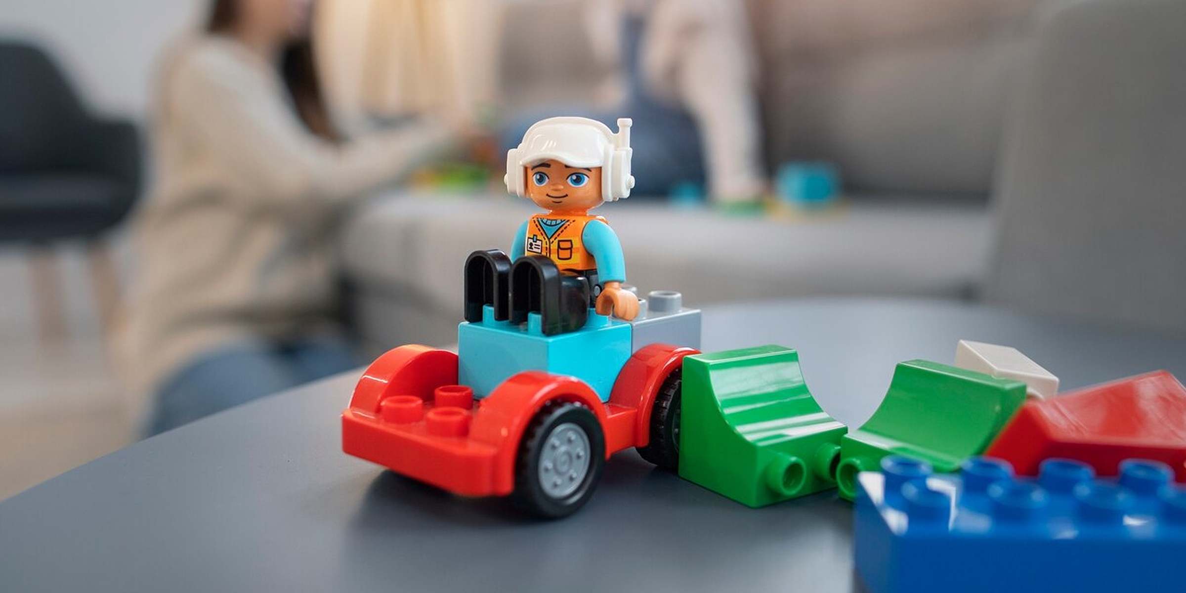 A toy figurine in a car built from blocks | Source: Freepik