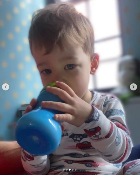 Wyatt Maisani-Cooper drinking from a bottle as he stares at the camera. | Source: Instagram/andersoncooper