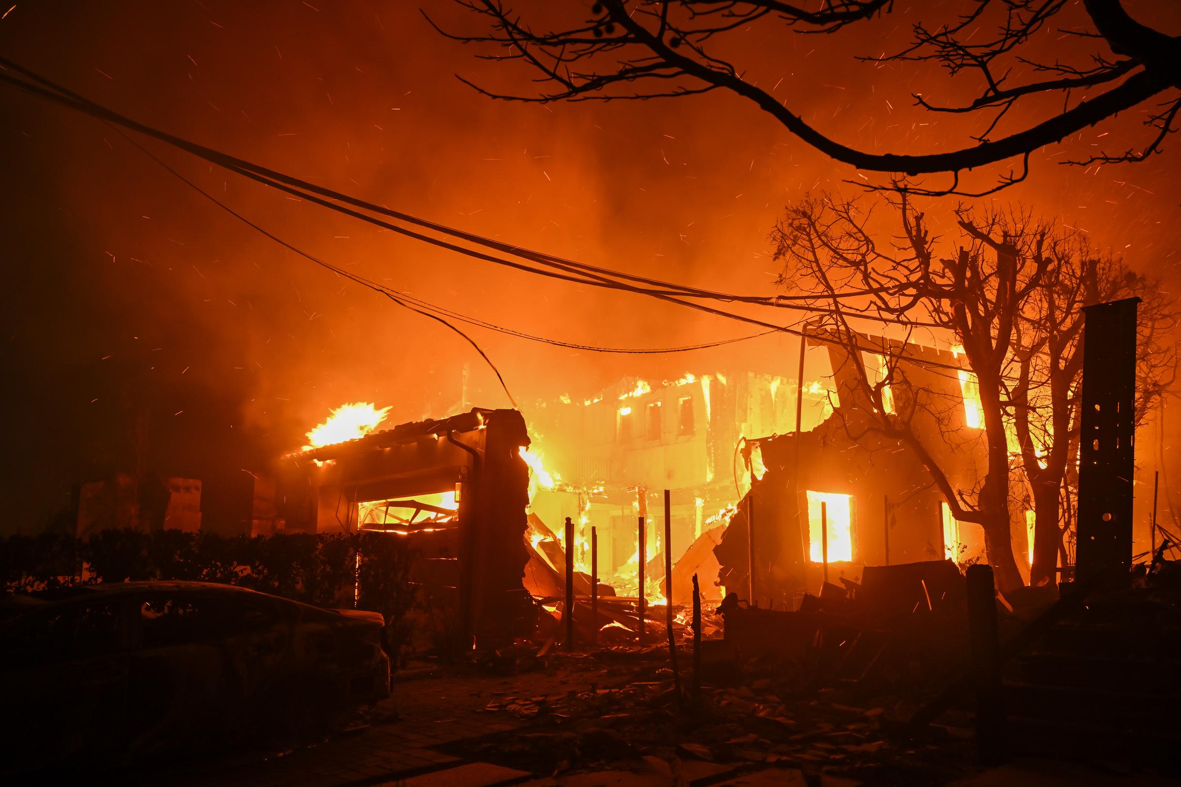 A home on fire in Pacific Palisades, California on January 8, 2025. | Source: Getty Images