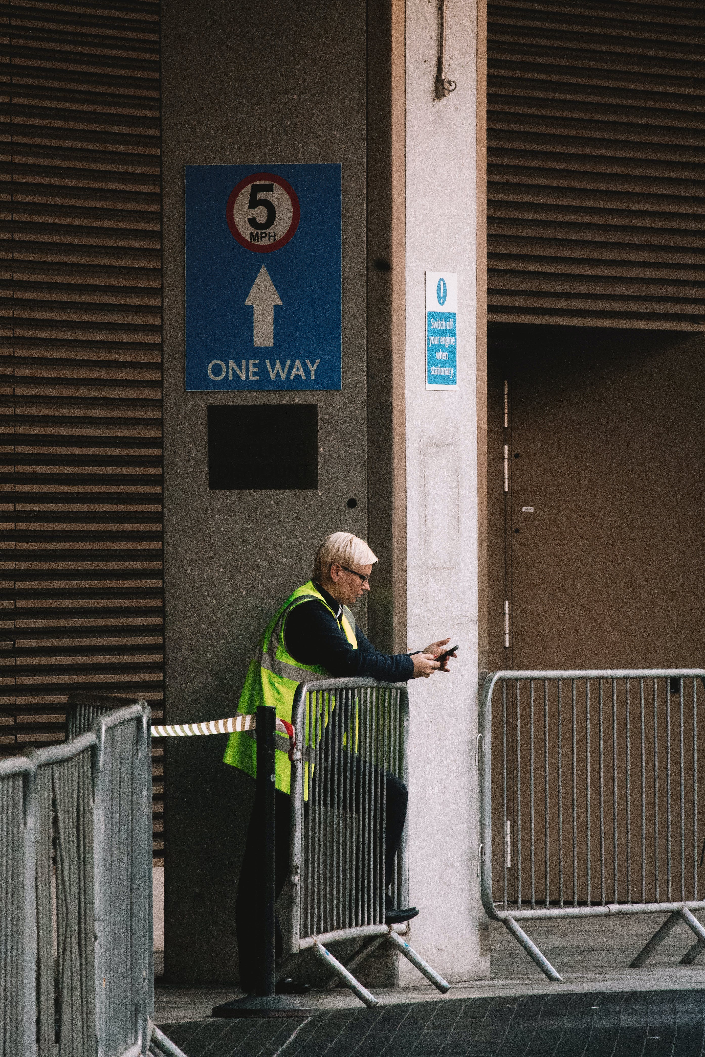 A security woman standing on a parking lot. | Source: Pexels