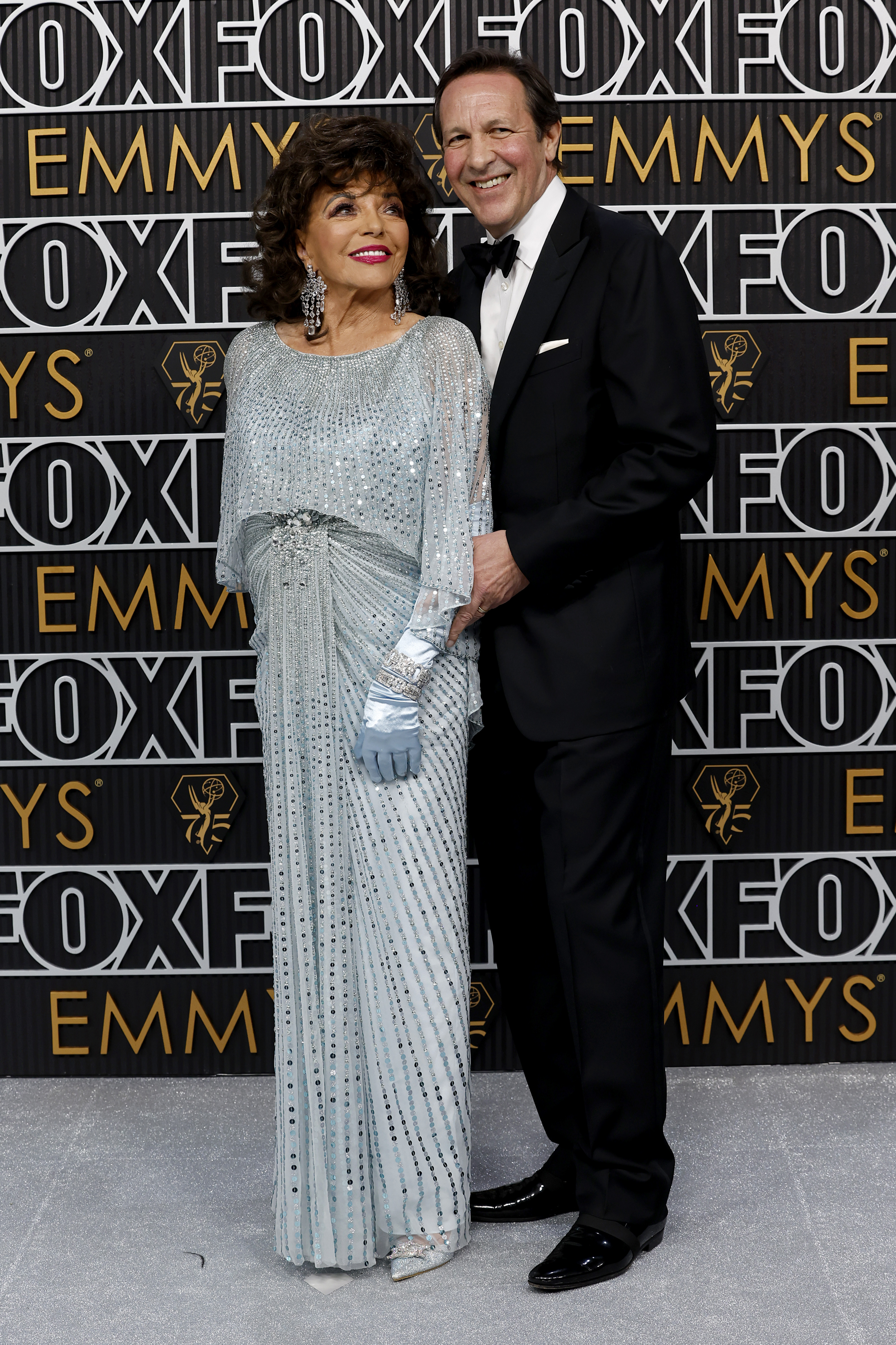 Joan Collins and Percy Gibson at the 75th Primetime Emmy Awards in Los Angeles, California on January 15, 2024 | Source: Getty Images