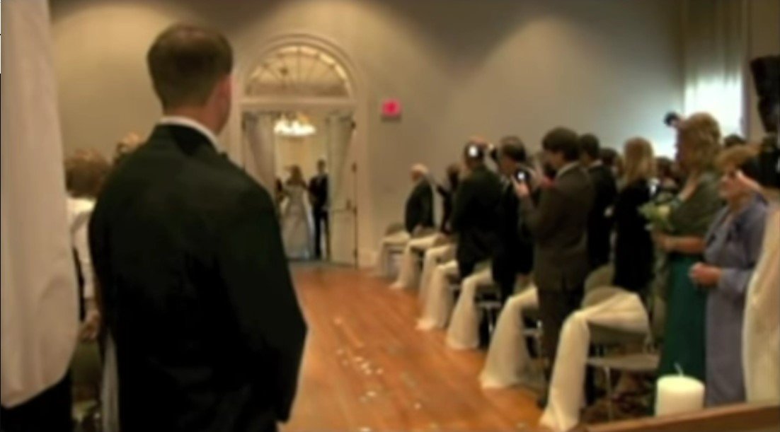 Mike Belawetz waiting on his bride to walk into the wedding hall | Source: Youtube/ Rehab Institute 