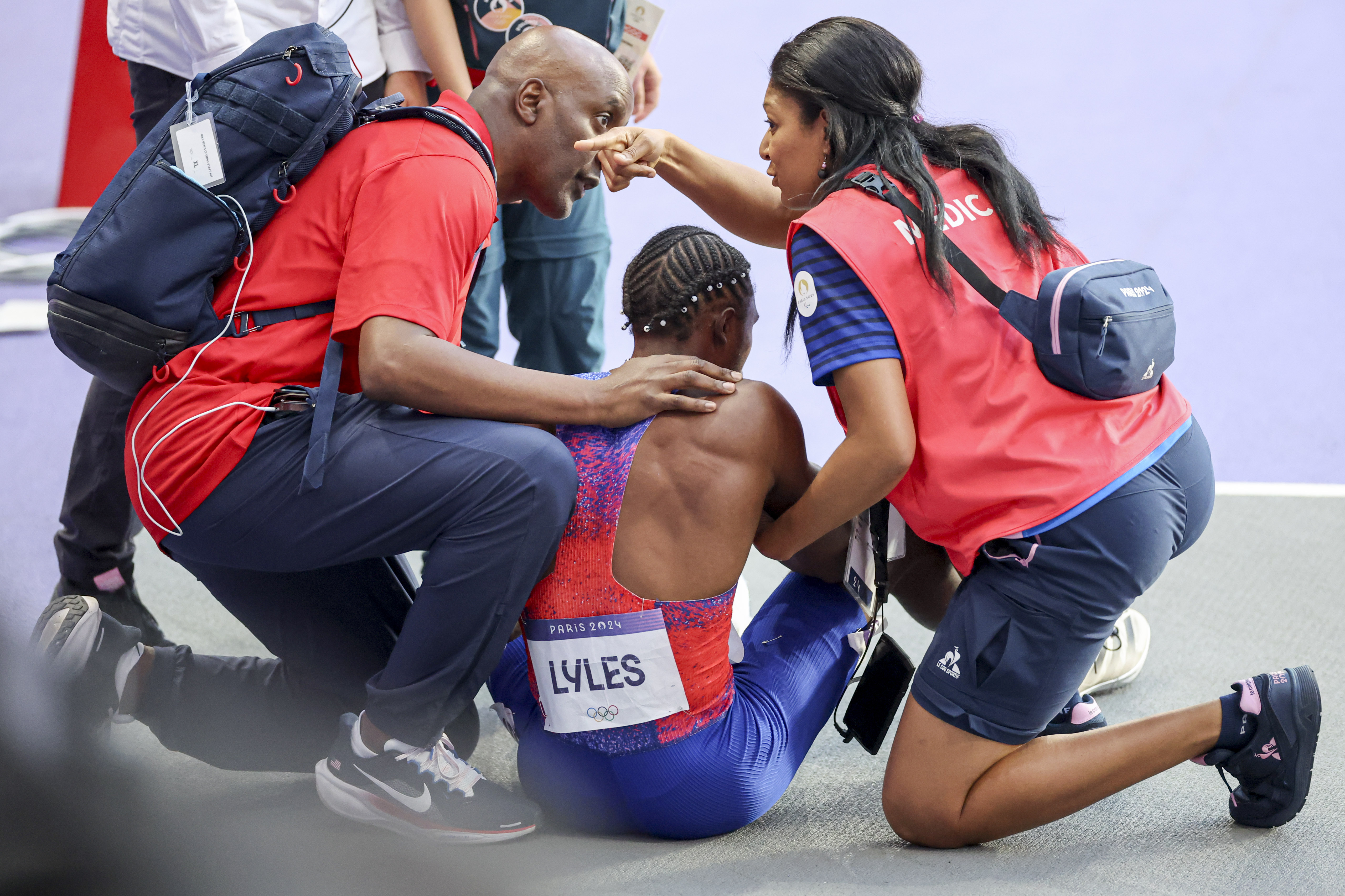 Noah Lyles of the US being attended to by medical assistants after competing in the Men's 200m Final during the Paris 2024 Summer Olympic Games on August 8, 2024, in Paris, France | Source: Getty Images