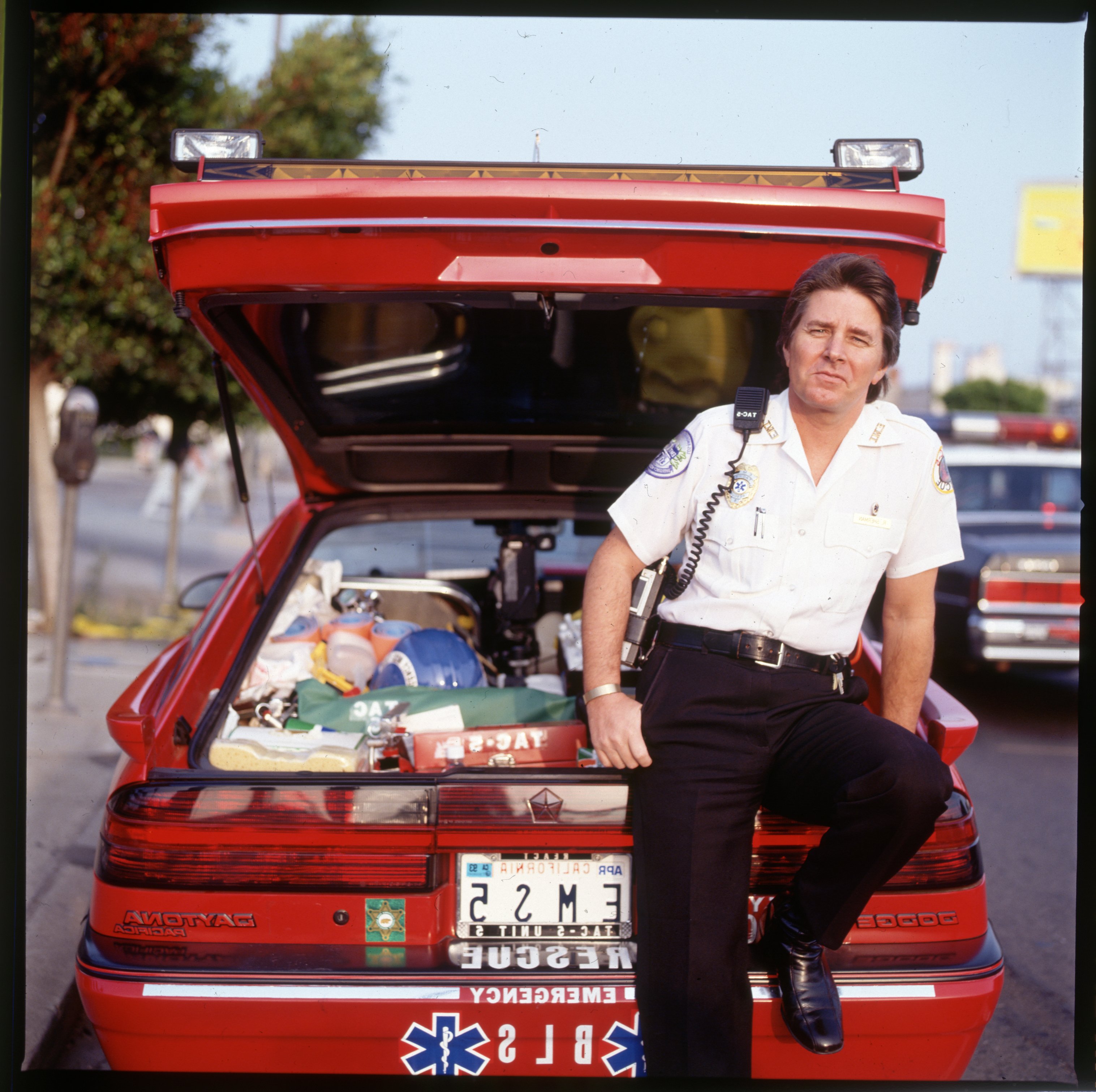 Bobby Sherman dressed as a paramedic, posing near an emergency vehicle. / Source: Getty Images