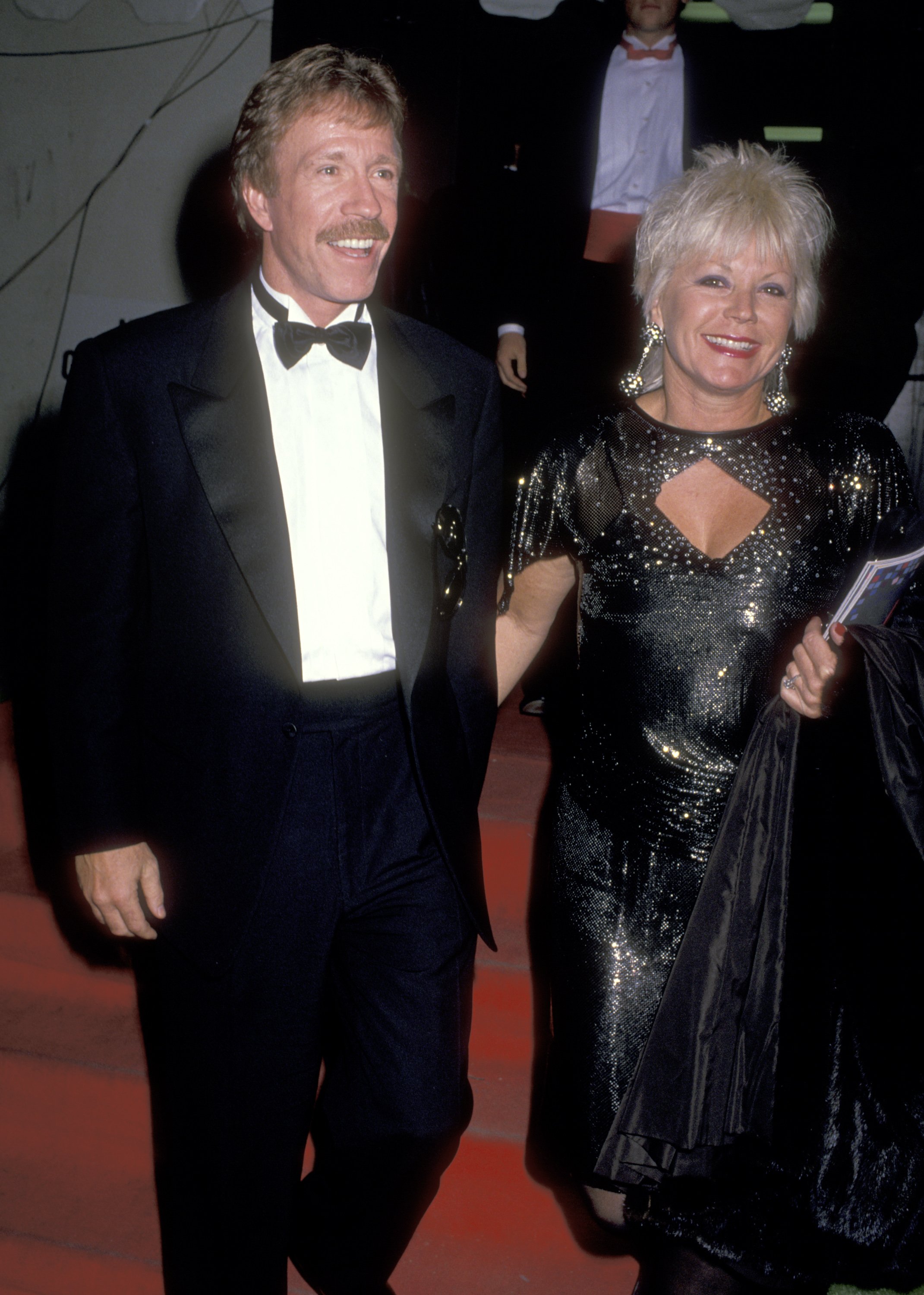 Chuck Norris and Diane Holechek are pictured at the 16th Annual American Music Awards on January 30, 1989, at Shrine Auditorium in Los Angeles, California | Source: Getty Images