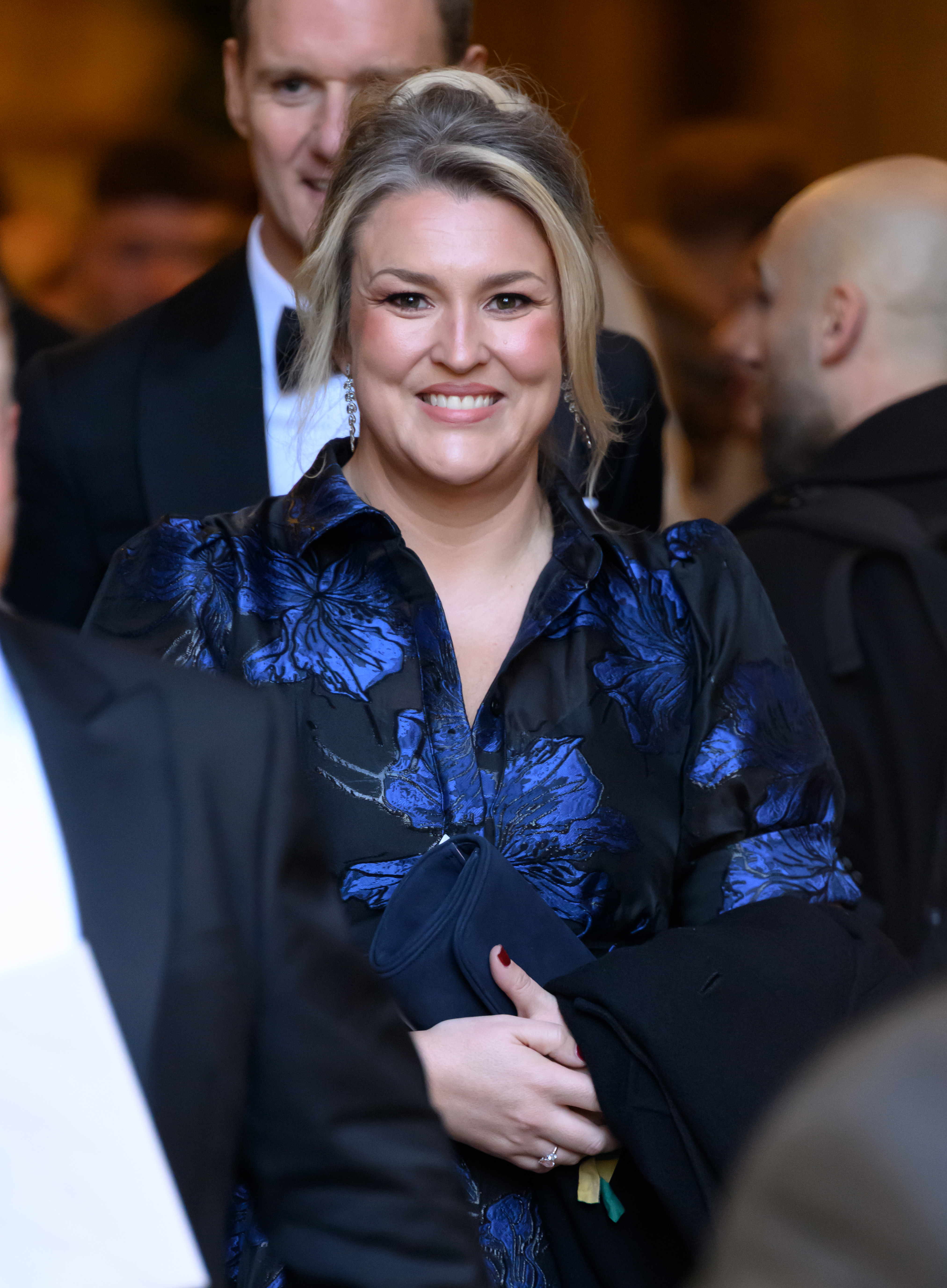 Sara Davies departs after attending the wedding of Adam Peaty and Holly Ramsay at Bath Abbey on 27 December 2025 in Bath, England. | Source: Getty Images
