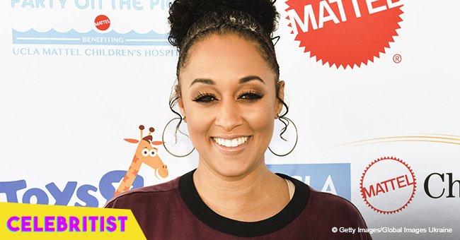 Tia Mowry steals hearts with photo of son and baby daughter in white tutu and big flower bow