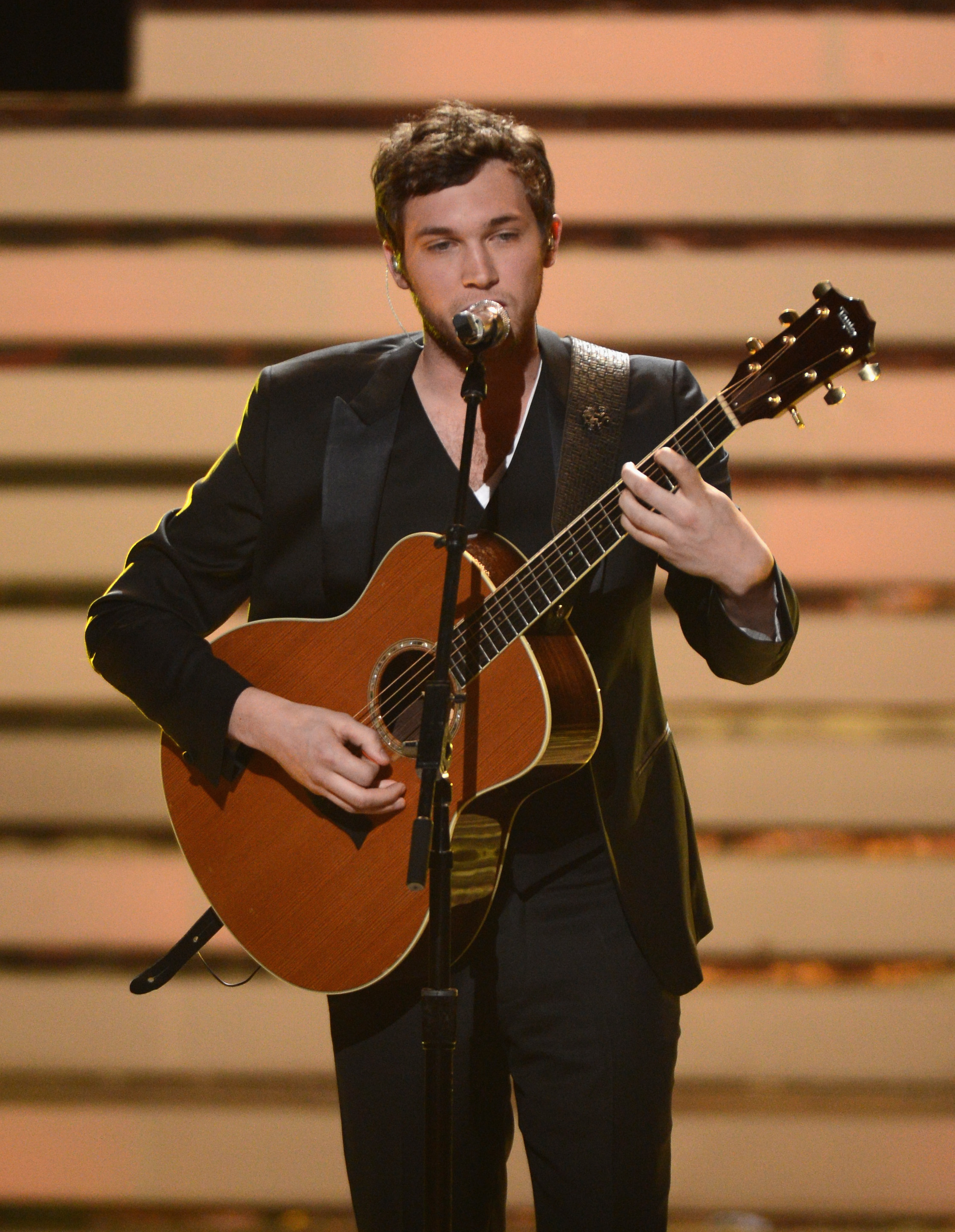 Phillip Phillips performs onstage after being announced as the winner during the "American Idol" Season 11 finale at Nokia Theatre L.A. Live in Los Angeles on May 23, 2012 | Source: Getty Images