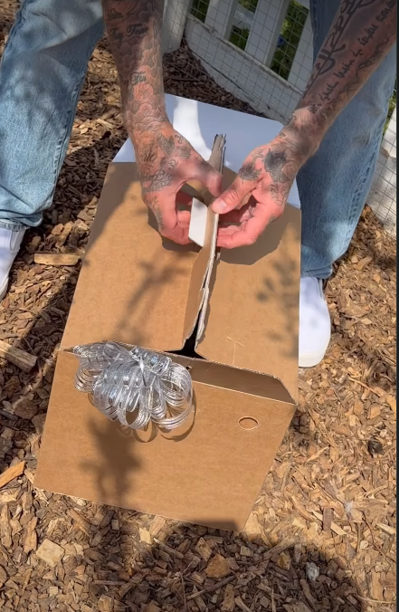 David Beckham unboxing his second gift box | Source: Instagram/victoriabeckham