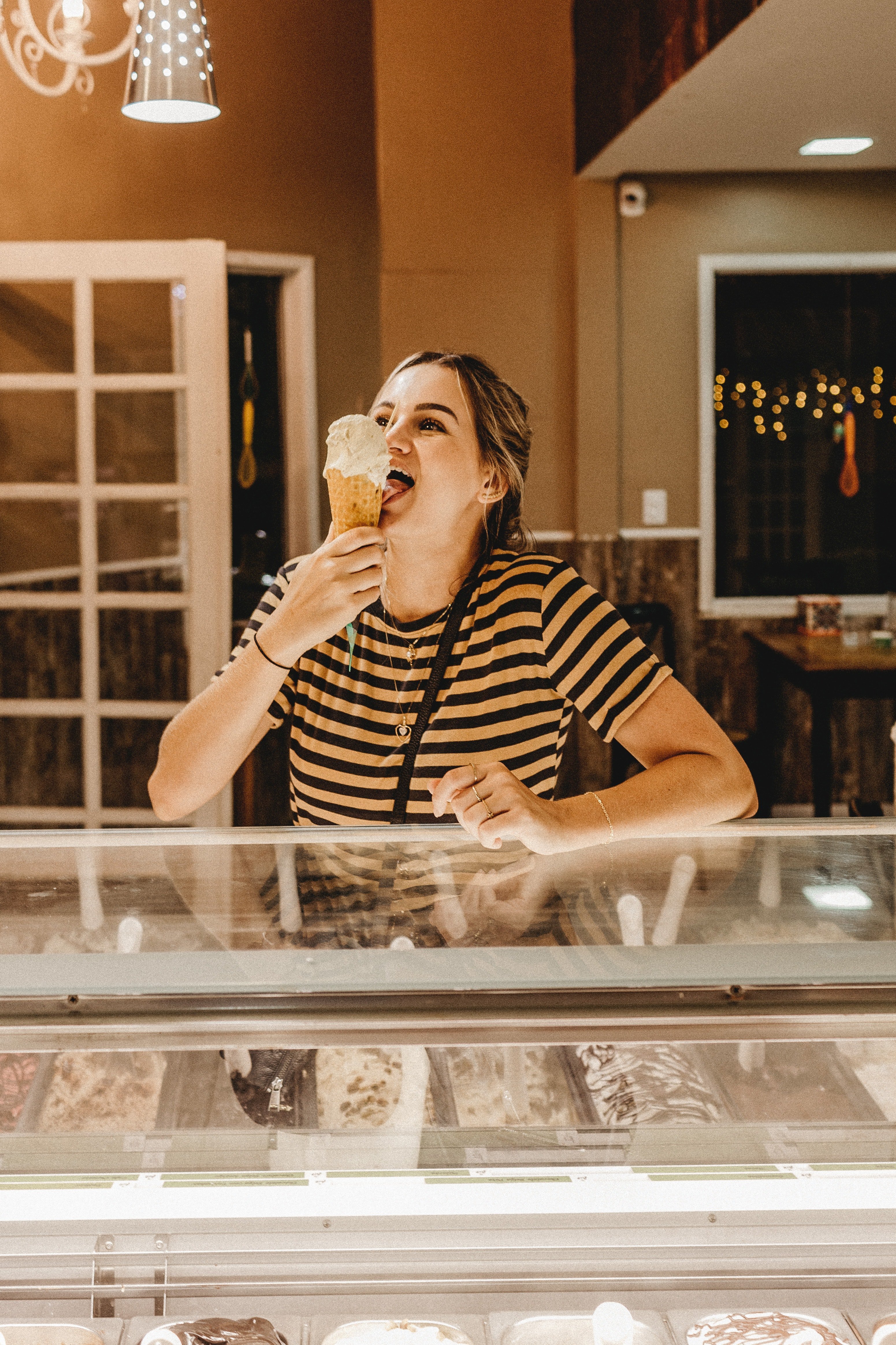 A woman eating ice cream. | Source: Pexels