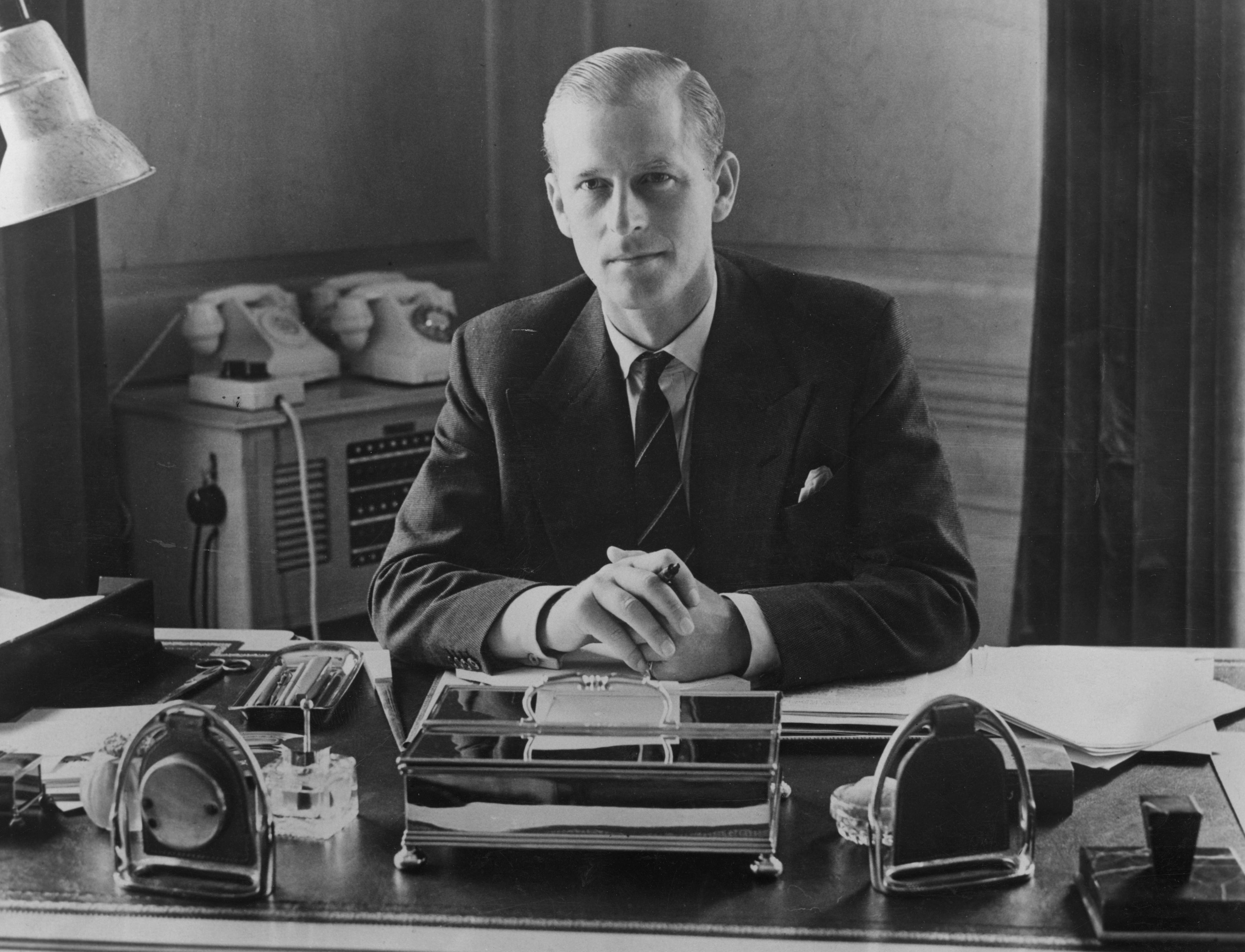 Prince Philip pictured at his desk at Clarence House, 1951, England. | Photo: Getty Images