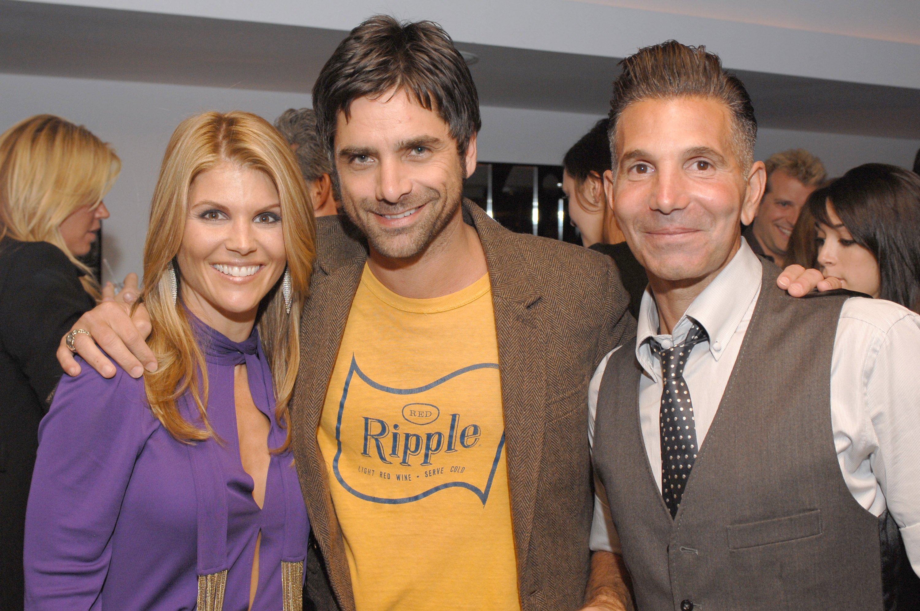 Lori Loughlin, John Stamos, and Mossimo Giannulli at a Target fashion party held in Giannulli's honor, October, 2006. | Photo: Getty Images. 