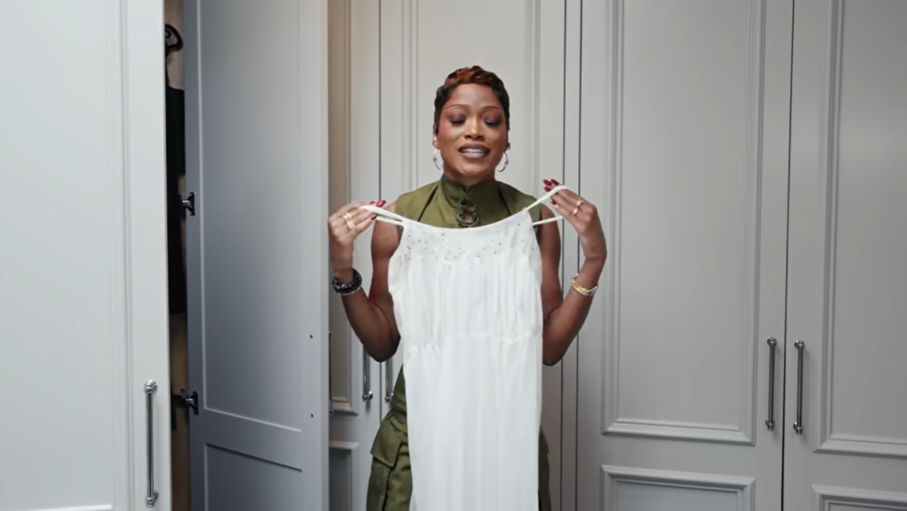 Palmer proudly displays her favorite white vintage muumuu dress, proving her bedtime routine is strictly all about "grandmaville." | Source: YouTube/@Archdigest