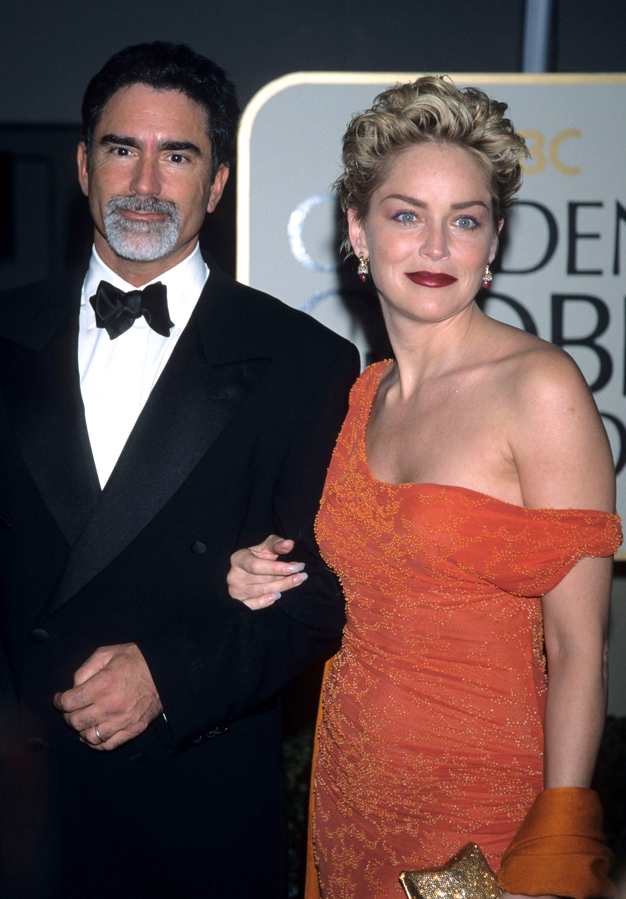 Phil Bronstein and Sharon Stone during The 56th Annual Golden Globe Awards - Red Carpet at Beverly Hilton Hotel in Beverly Hills, California, United States. | Source: Getty Images