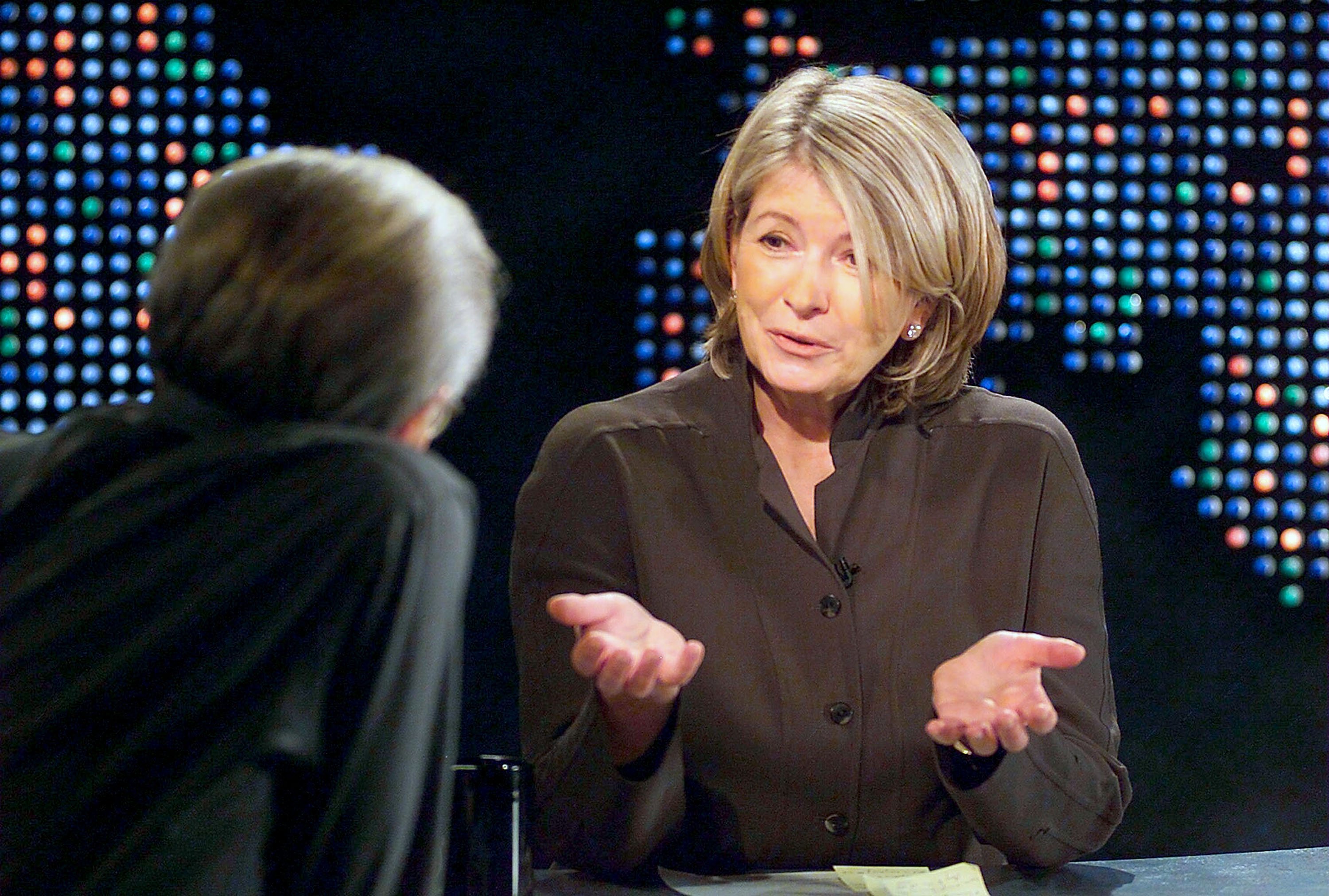 CNN's Larry King interviews Martha Stewart during a taping of Larry King Live on Saturday, December 20, 2003. | Source: Getty Images