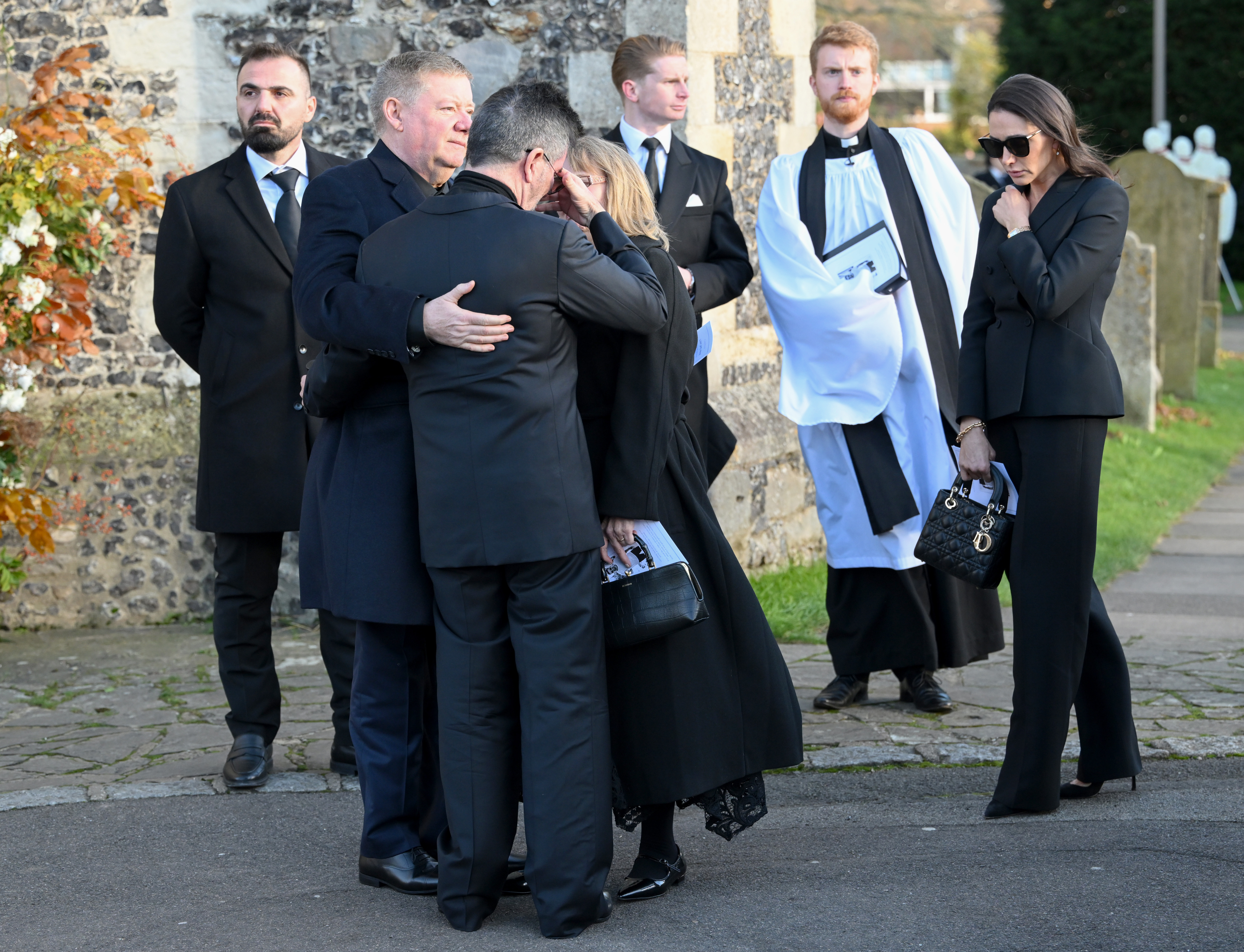 Simon Cowell is comforted by Geoff Payne at Liam Payne's funeral on November 20, 2024 in Amersham, England. | Source: Getty Images