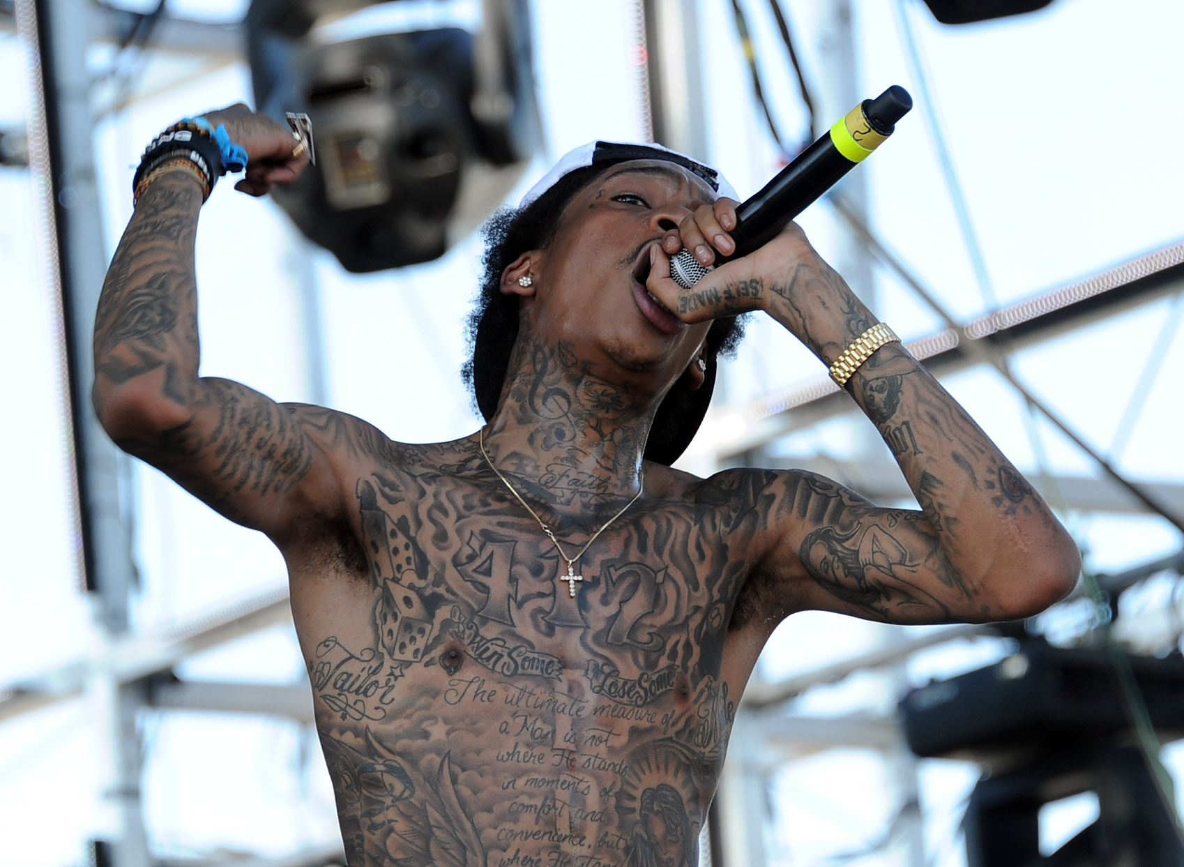 A close-up of Wiz Khalifa's tattoos captured while he performed during Day 3 of the Coachella Valley Music & Arts Festival on April 17, 2011, in Indio, California. | Source: Getty Images