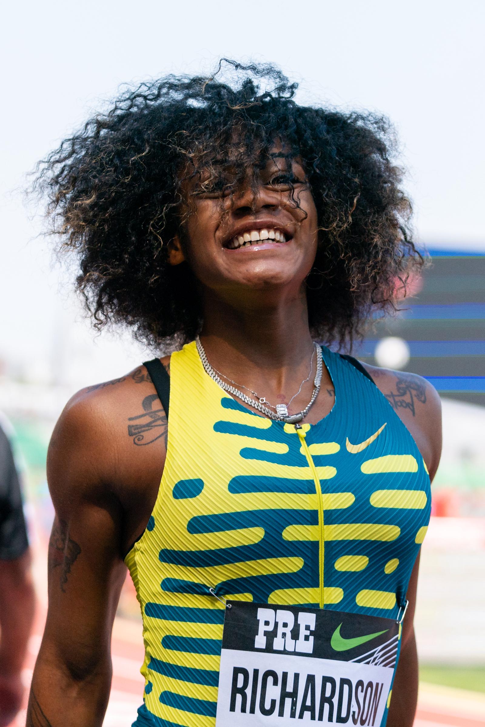 Sha'Carri Richardson smiles towards the crowd after competing in the Women's 100m during the 2023 Prefontaine Classic and Wanda Diamond League Final on September 16, 2023, in Eugene, Oregon. | Source: Getty Images