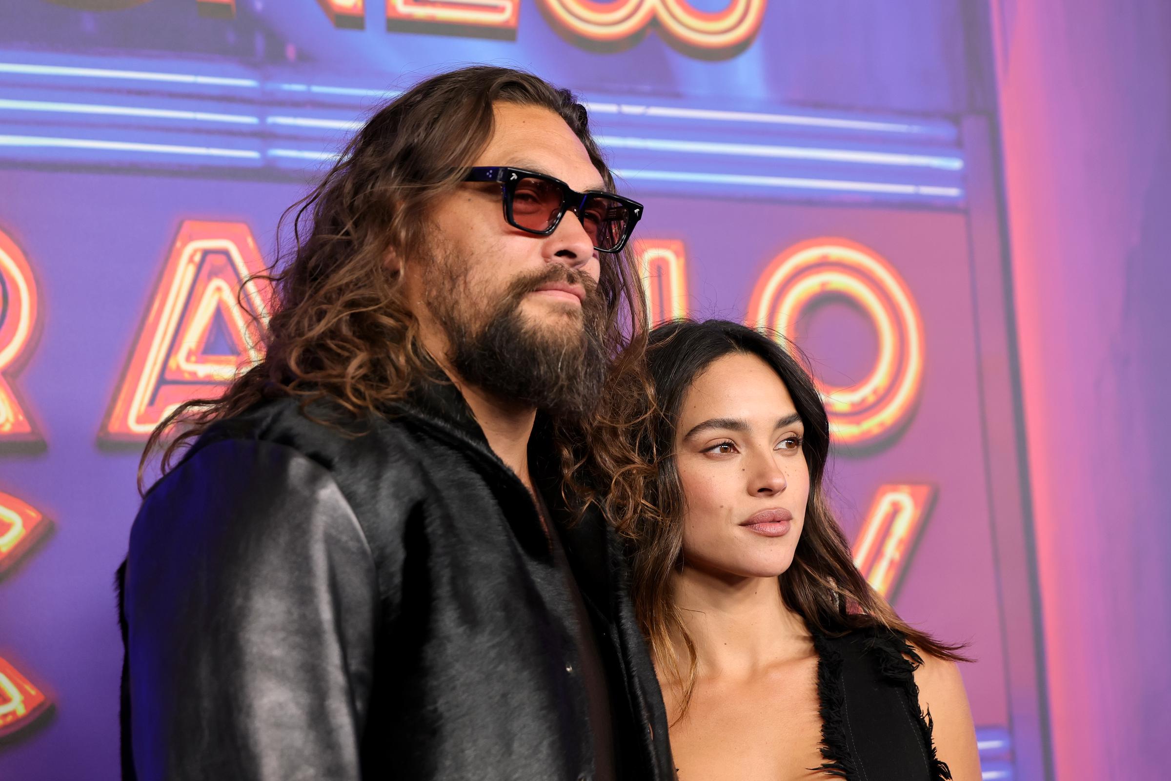 Jason Momoa and Adria Arjona are pictured at "SNL50: The Homecoming Concert" at Radio City Music Hall on February 14, 2025, in New York | Source: Getty Images