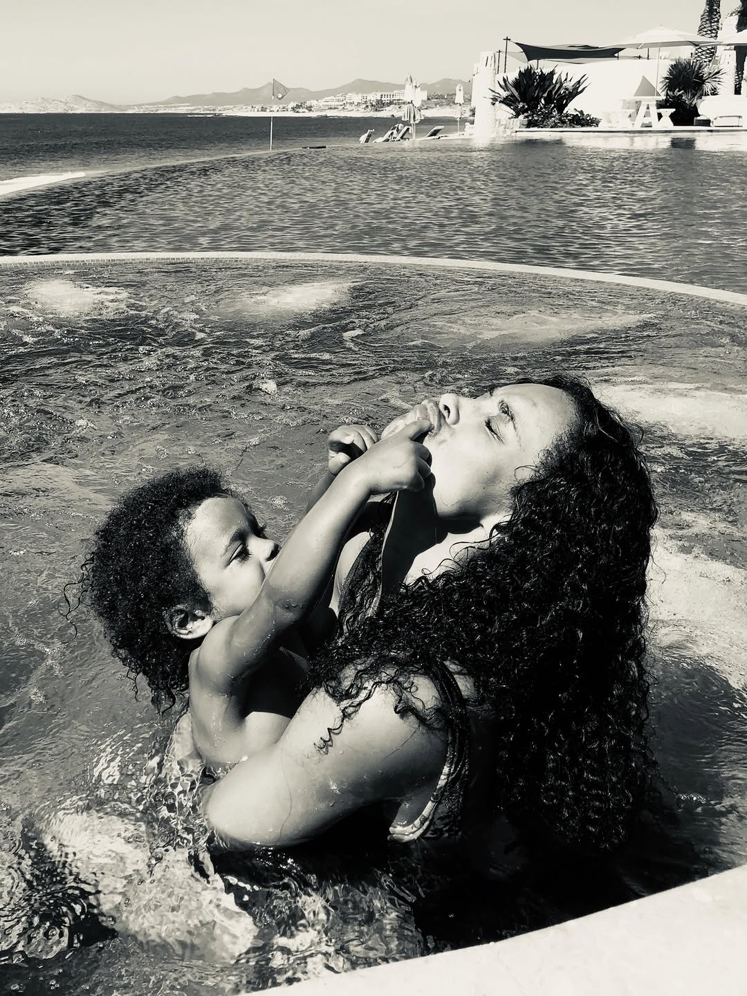 Ciara sharing a playful moment in a pool with one of her kids. | Source: Instagram/ciara