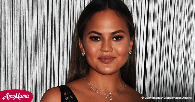 Chrissy Teigen, 32, shows off her enormous baby bump as she sports a skintight all-black outfit