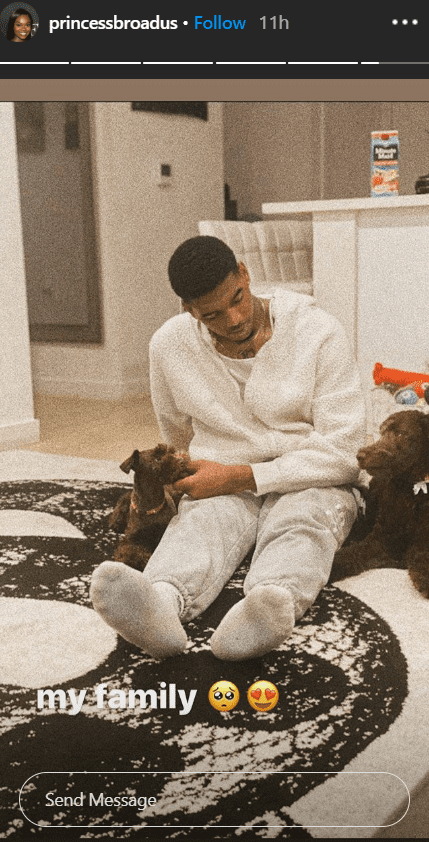 Cori Broadus posted a photo of her boyfriend, Ez, on a rug with her dogs Zayne and Charli | Source: Instagram.com/princessbroadus