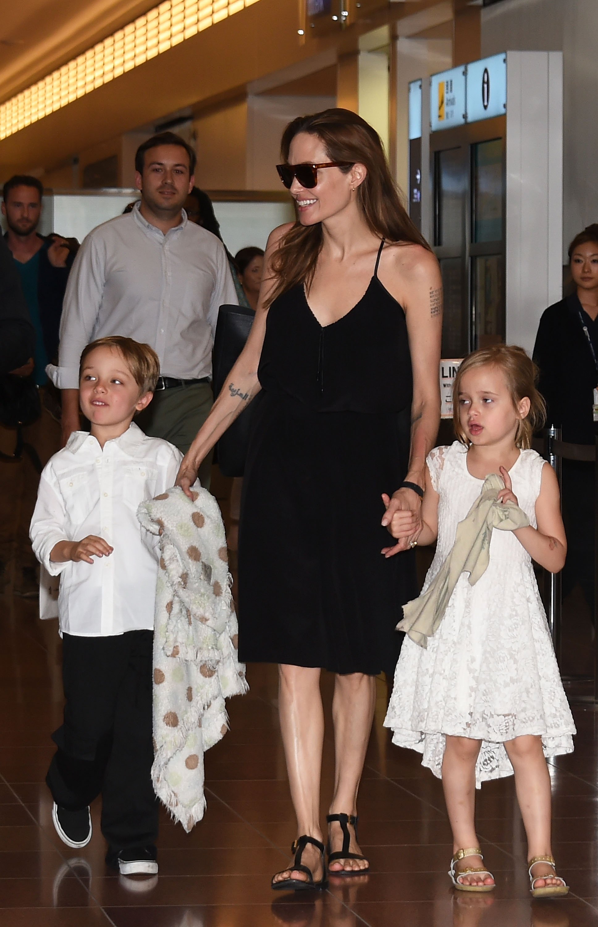 Knox Jolie-Pitt, Angelina Jolie and Vivienne Jolie-Pitt are seen upon arrival at Haneda Airport on June 21, 2014 in Tokyo, Japan. | Source: Getty Images