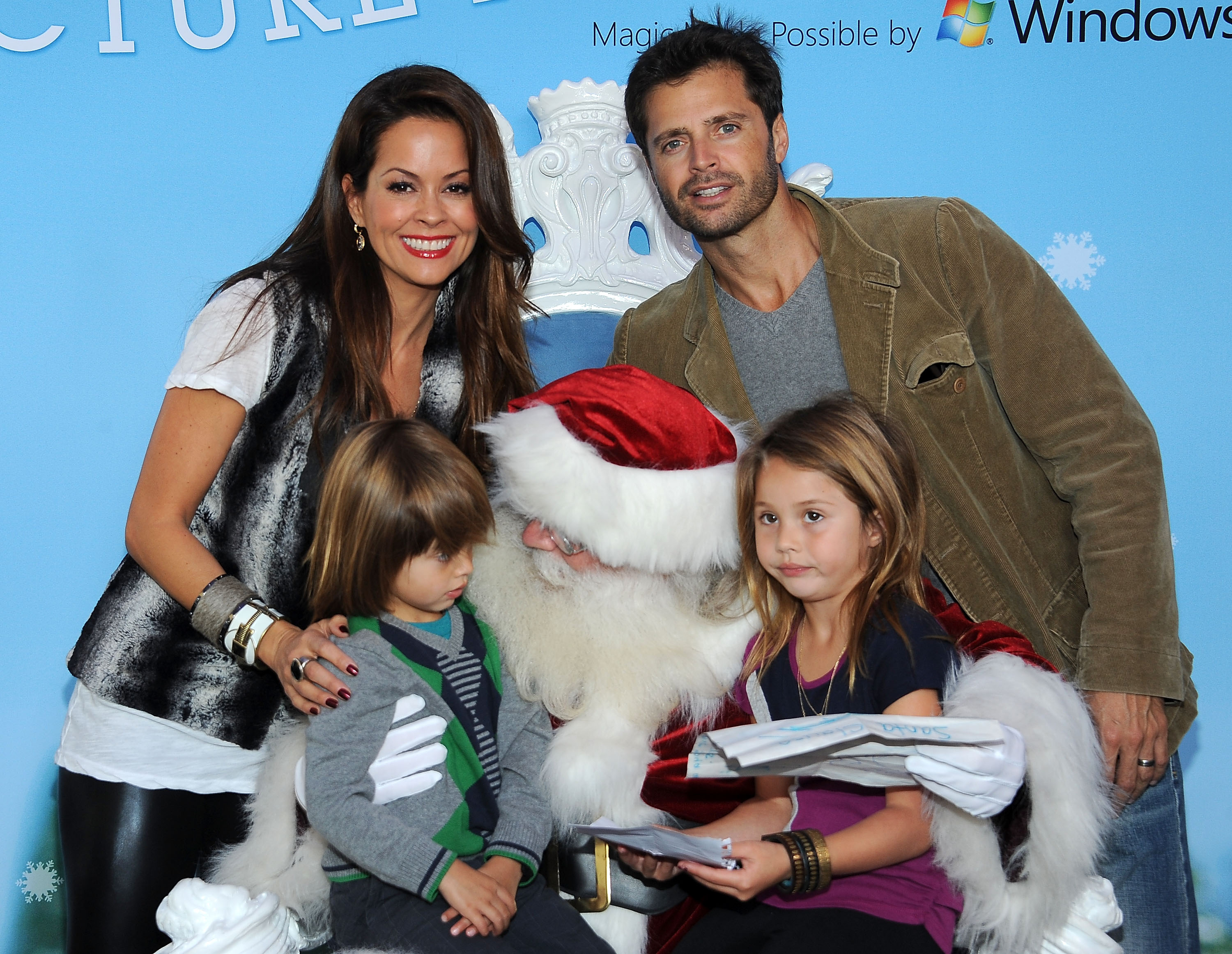 Brooke Burke, Shaya, Rain and David Charvet pose with Santa Claus on November 23, 2011, in Century City, California. | Source: Getty Images