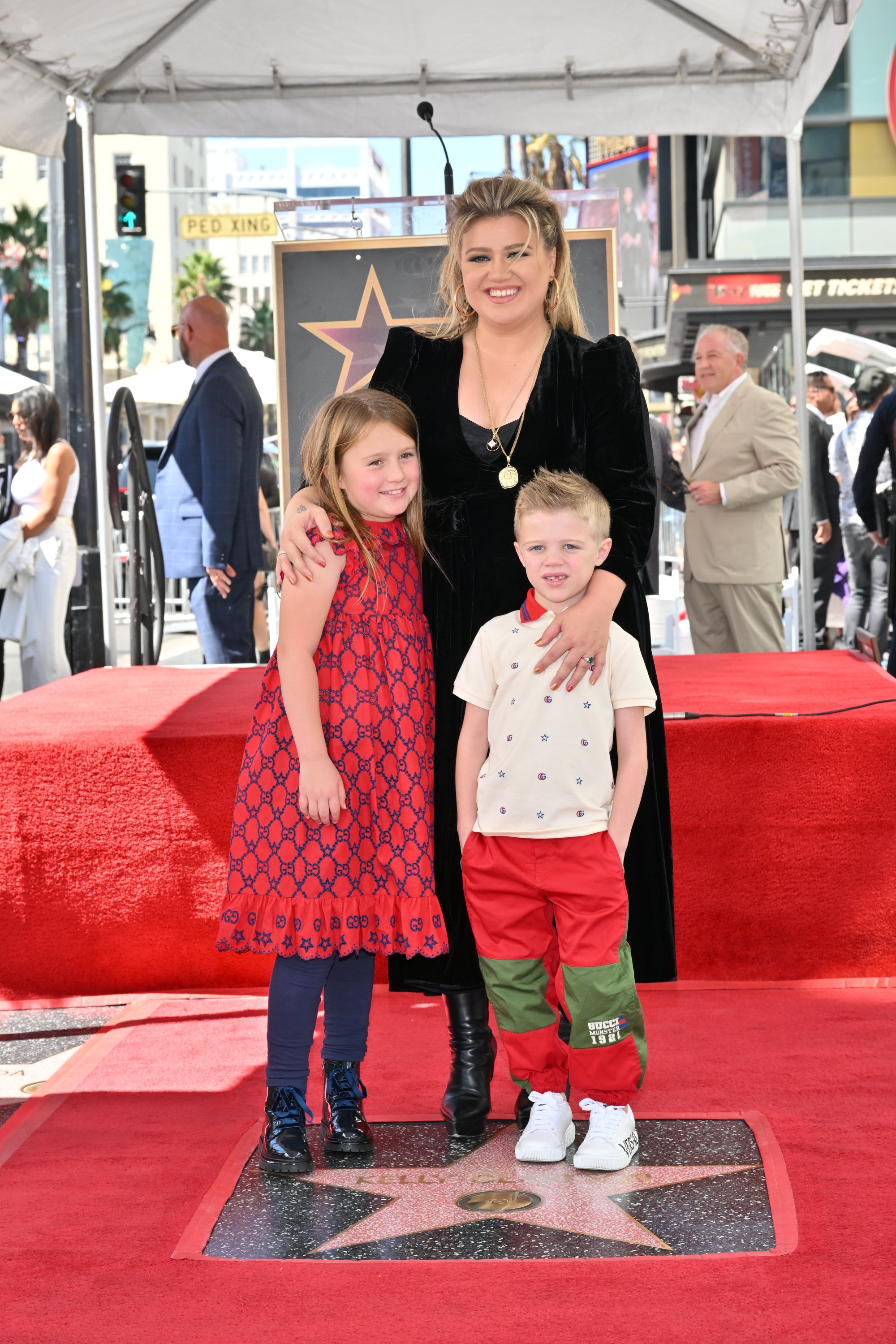 Kelly Clarkson and her children River Rose Blackstock and Remington Alexander Blackstock on the Hollywood Walk of Fame in 2022. | Source: Getty Images