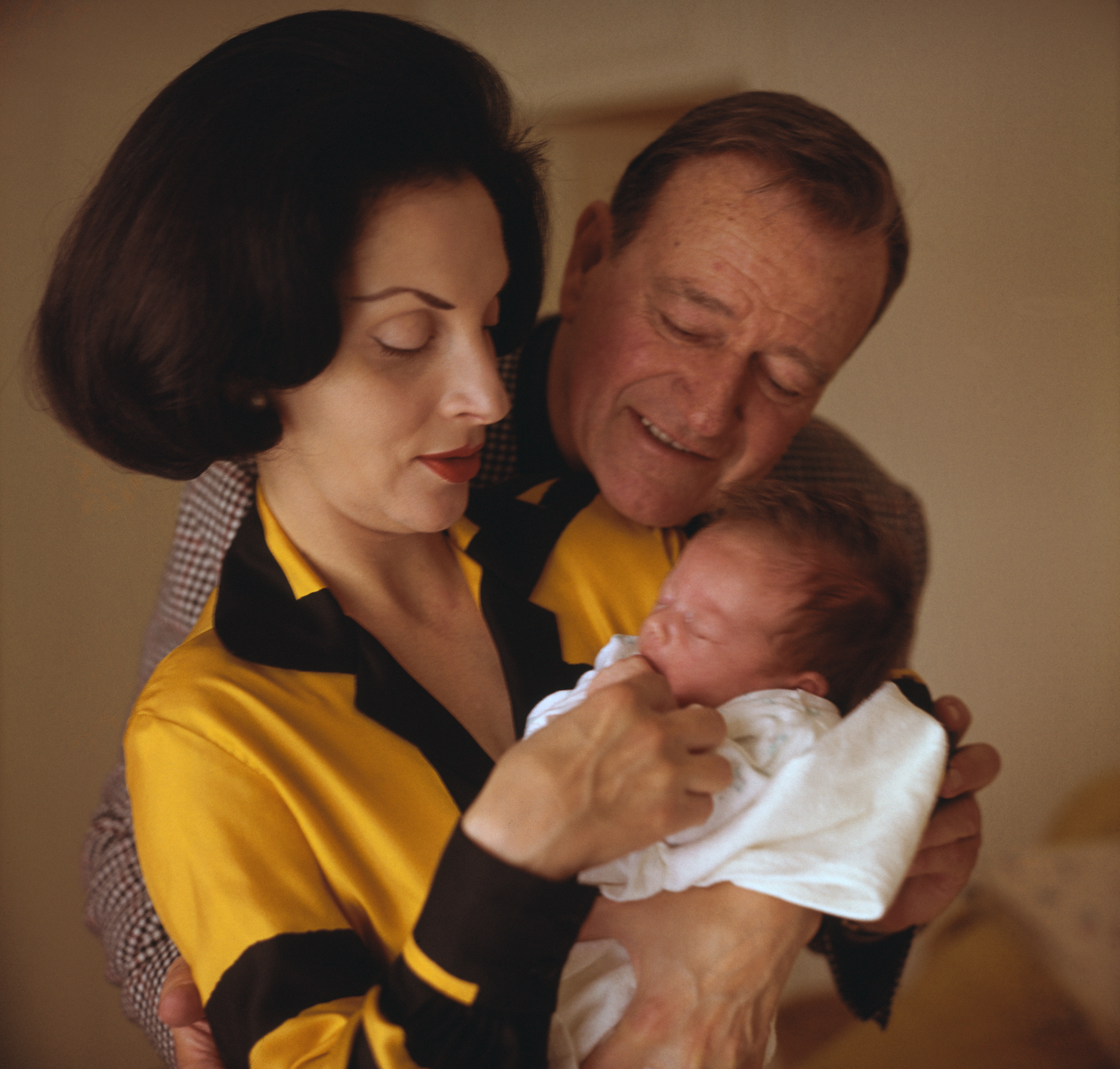 John Wayne, his new baby, Marisa Carmela and wife Pilar. at Wayne's home. | Source: Getty Images