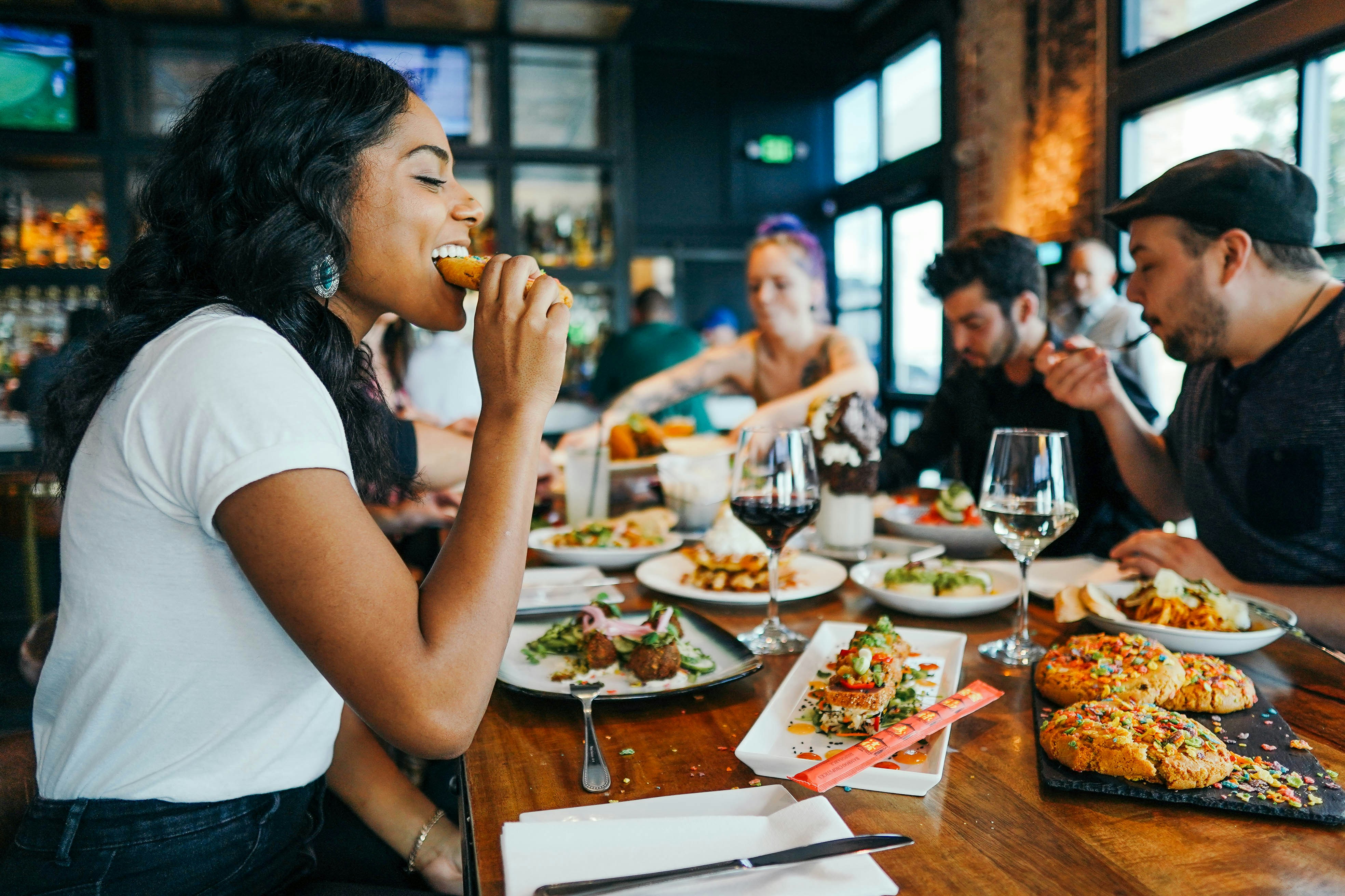 Woman enjoying her meal at a restaurant | Source: Unsplash