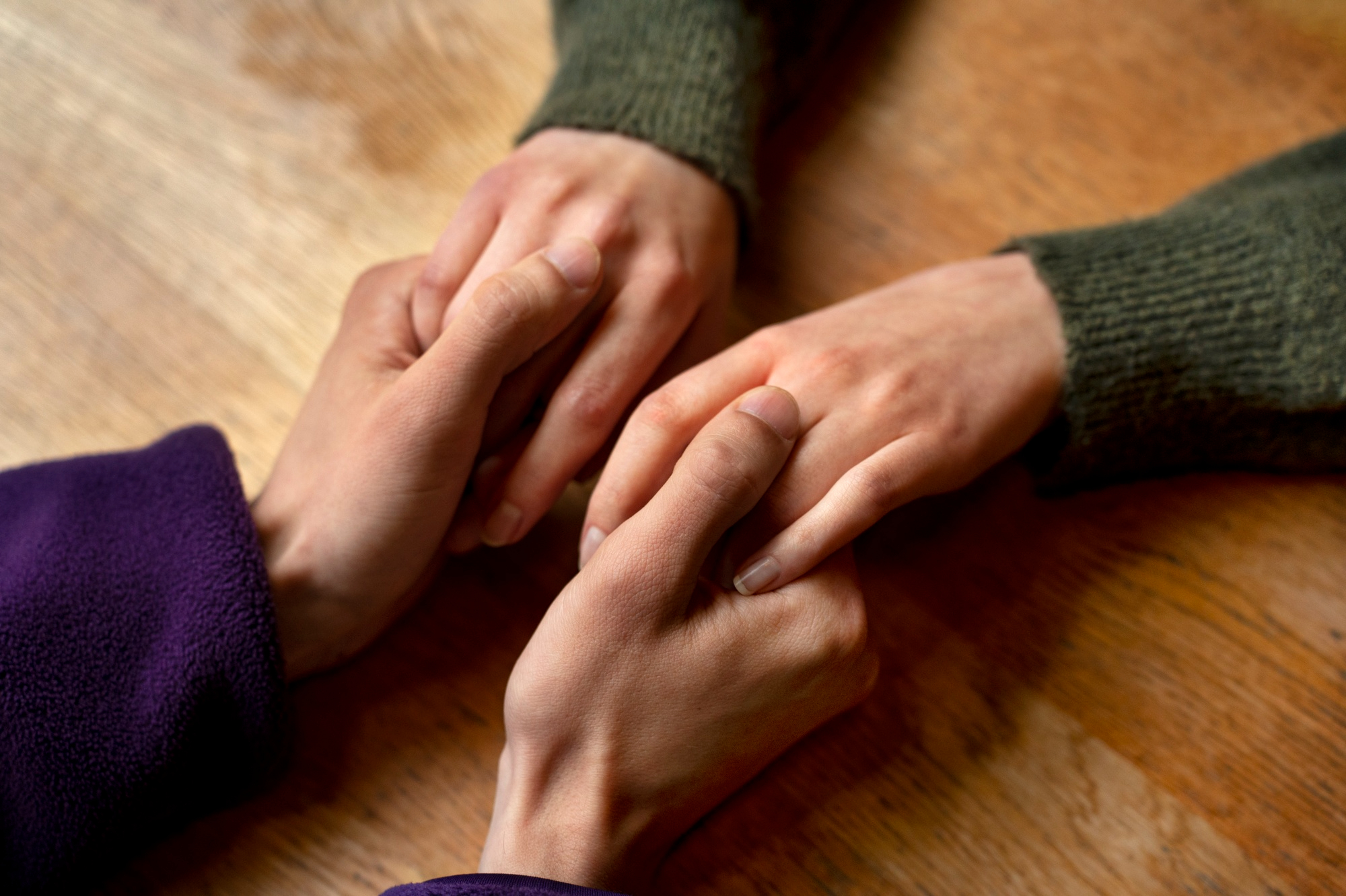 A closeup shot of a man holding a woman's hands for support | Source: Freepik