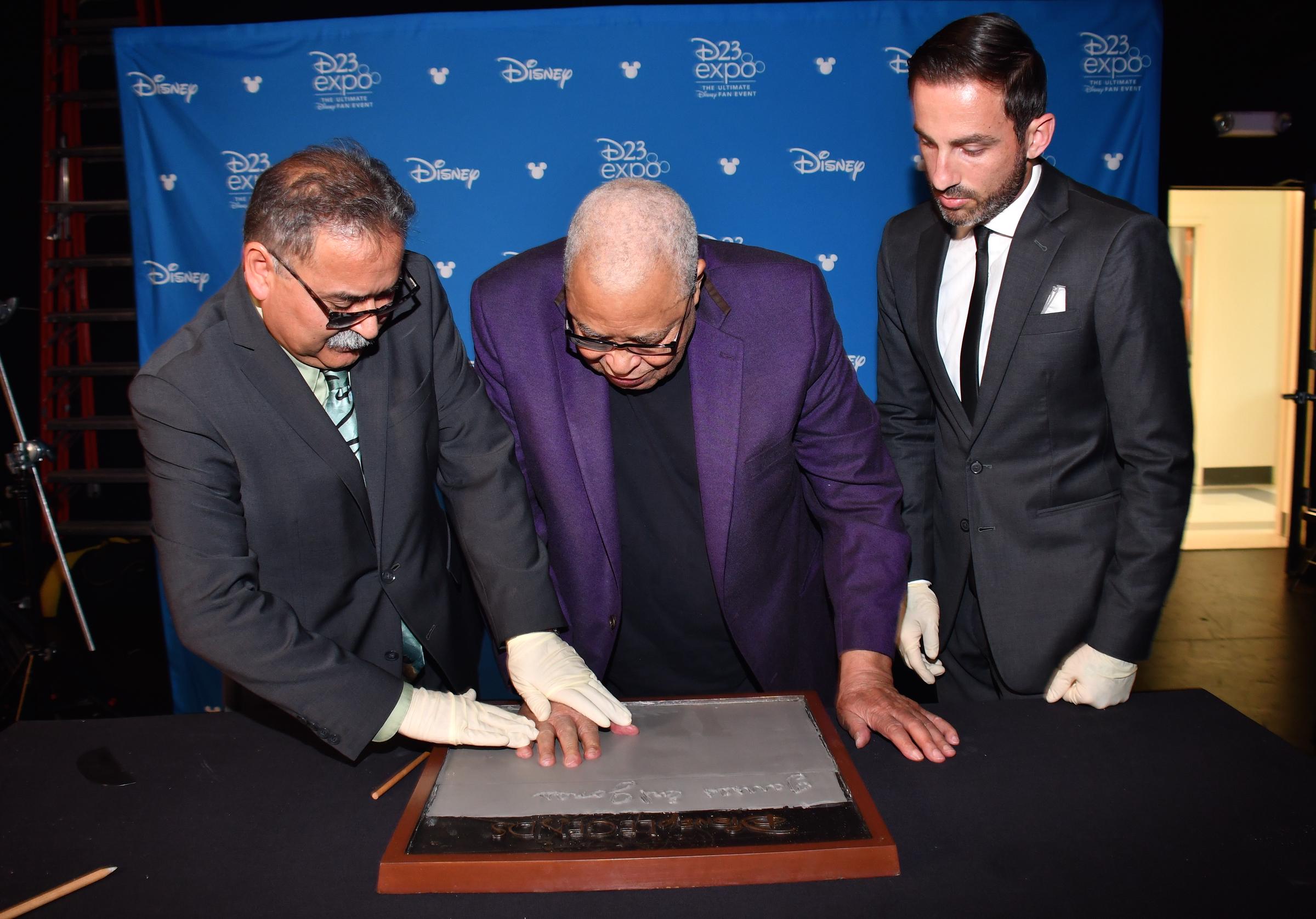 James Earl Jones shown casting his hand in cement for Disney during a special event on July 10, 2019, in Pawling, New York. | Source: Getty Images