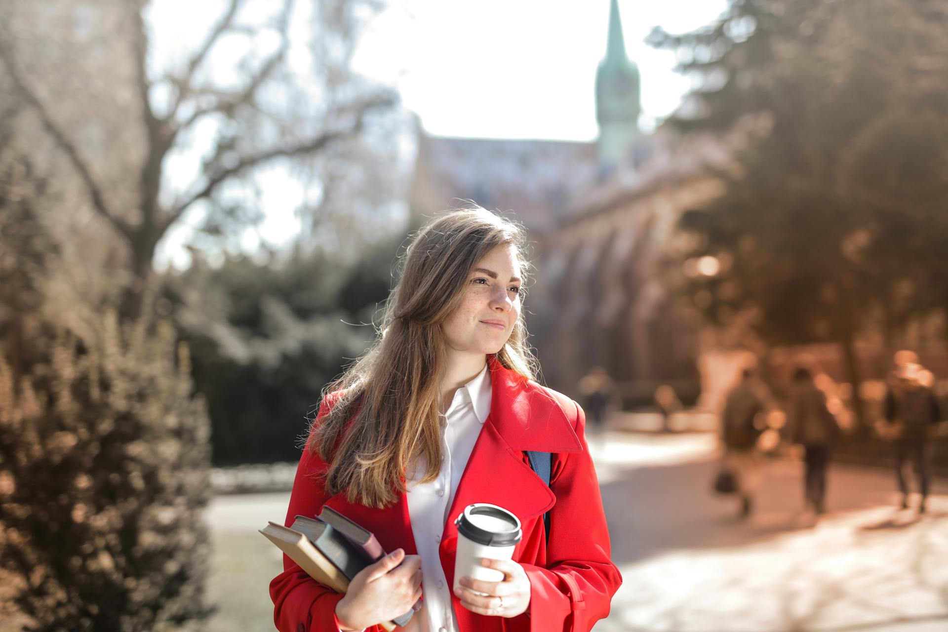 A woman in a red coat | Source: Pexels