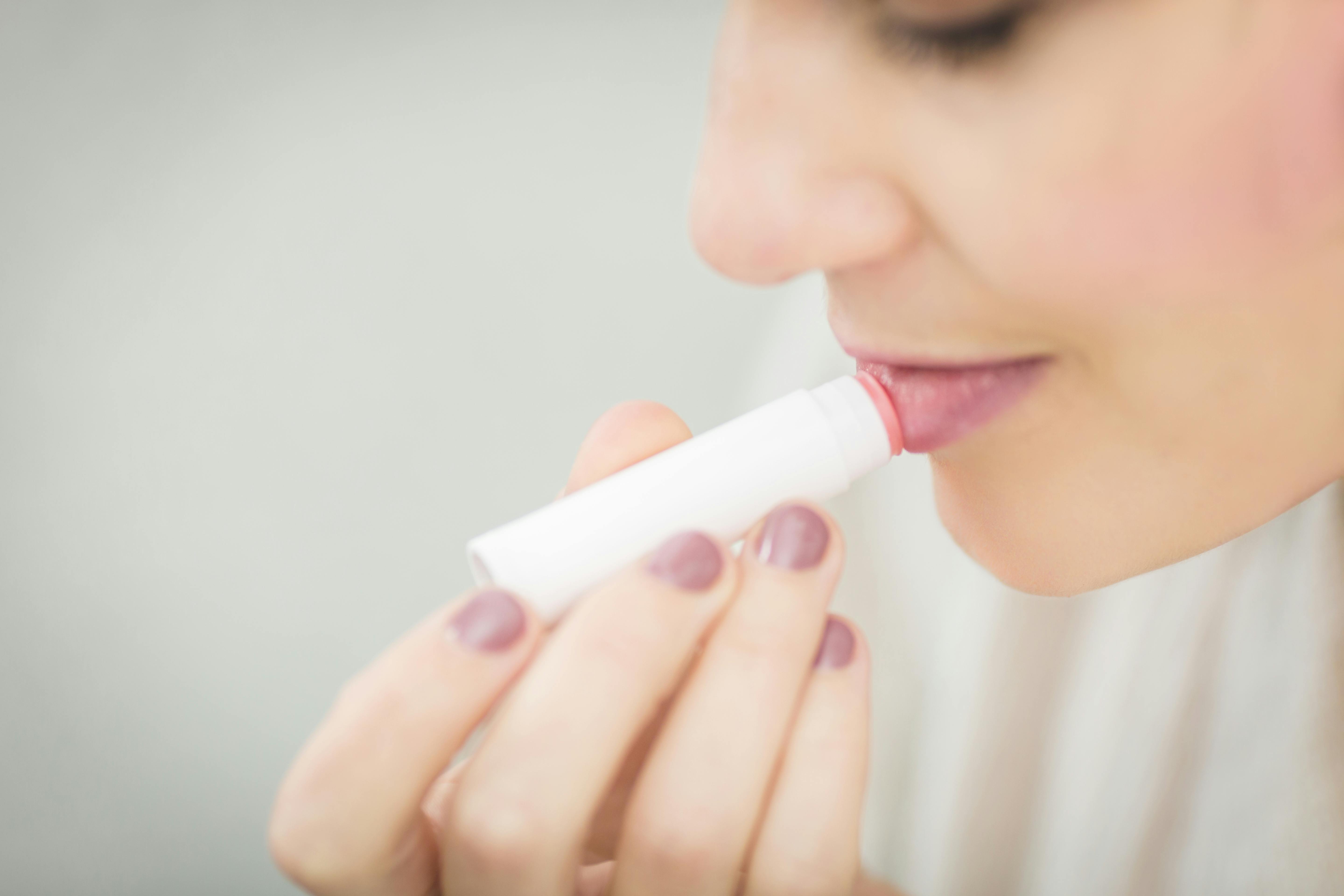 Use lip peptide before applying lipstick | Source: Pexels