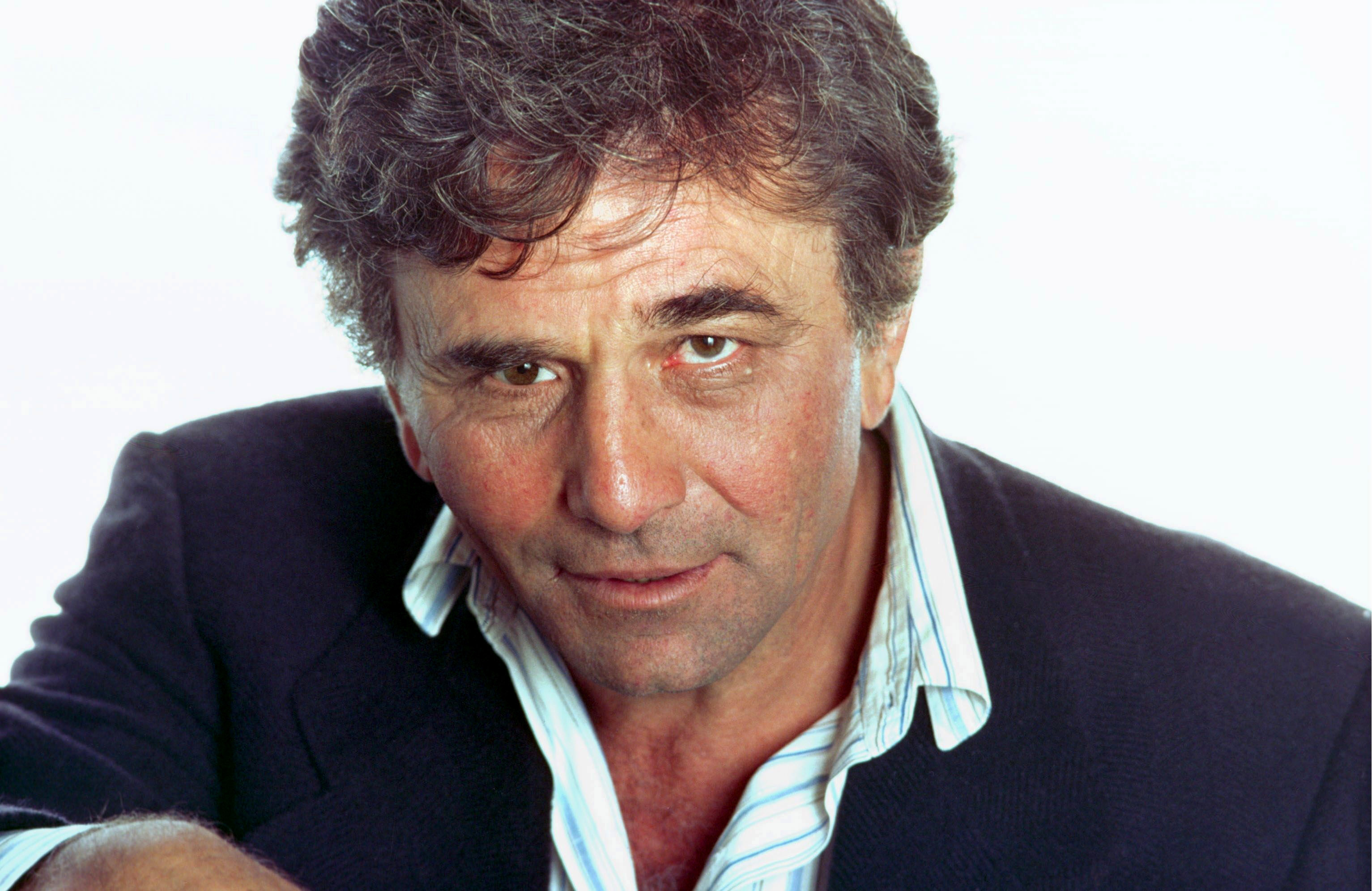 American actor Peter Falk, best known for his role as Lieutenant Columbo in the television series Columbo, poses for a photograh during a visit to Michel Drucker's TV Show 'Champs-Elysees' in 1982 in Paris, France. | Source: Getty Images