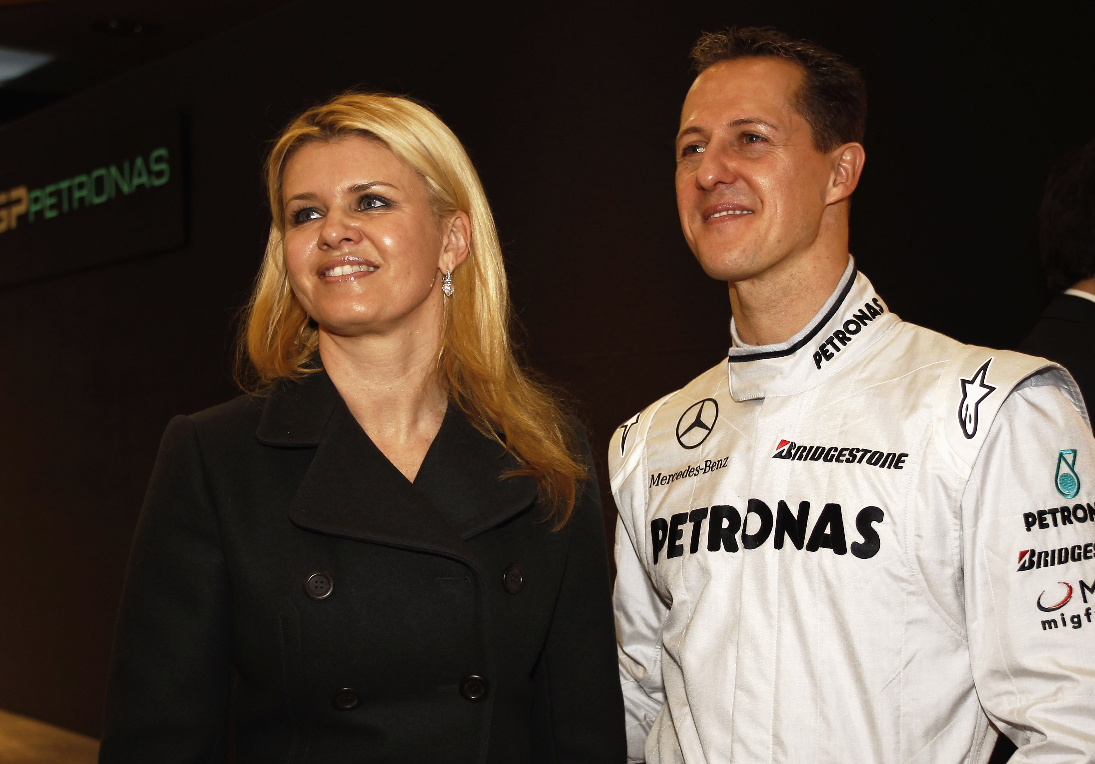 Michael Schumacher of Germany and Mercedes GP Petronas talks with his wife Corrina on January 25, 2010 in Stuttgart, Germany. | Source: Getty Images