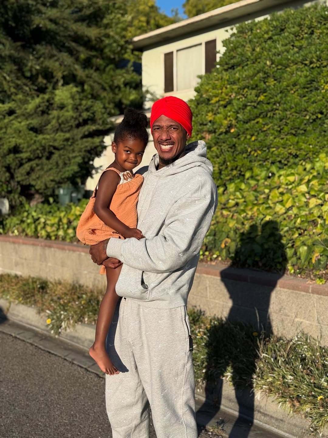 Nick Cannon carries his daughter Onyx Cannon from a post dated August 1, 2025. | Source: Instagram/nickcannon