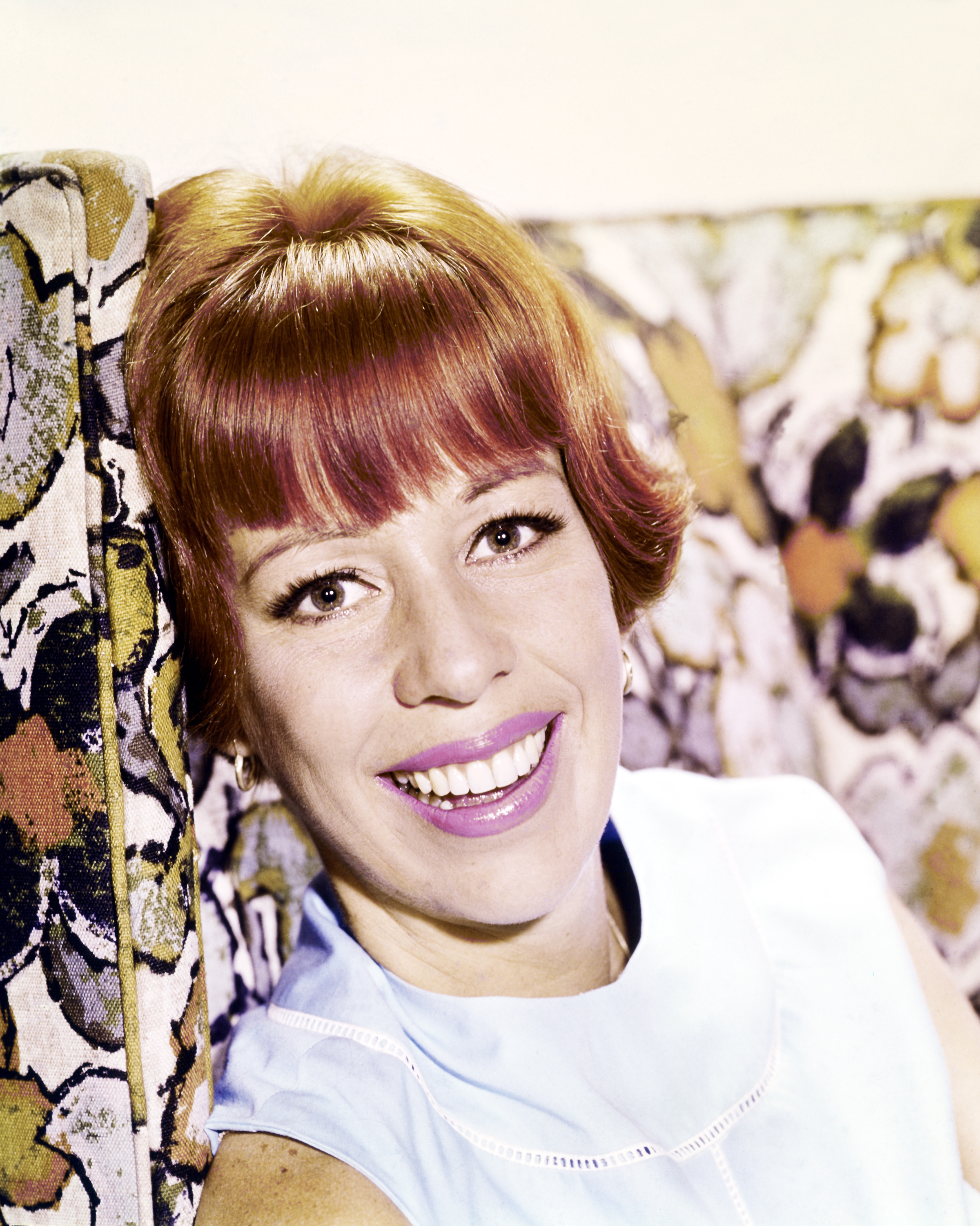 Singer Carol Burnett pictured while resting her head against a patterned cushion on January 1, 1970 | Source: Getty Images