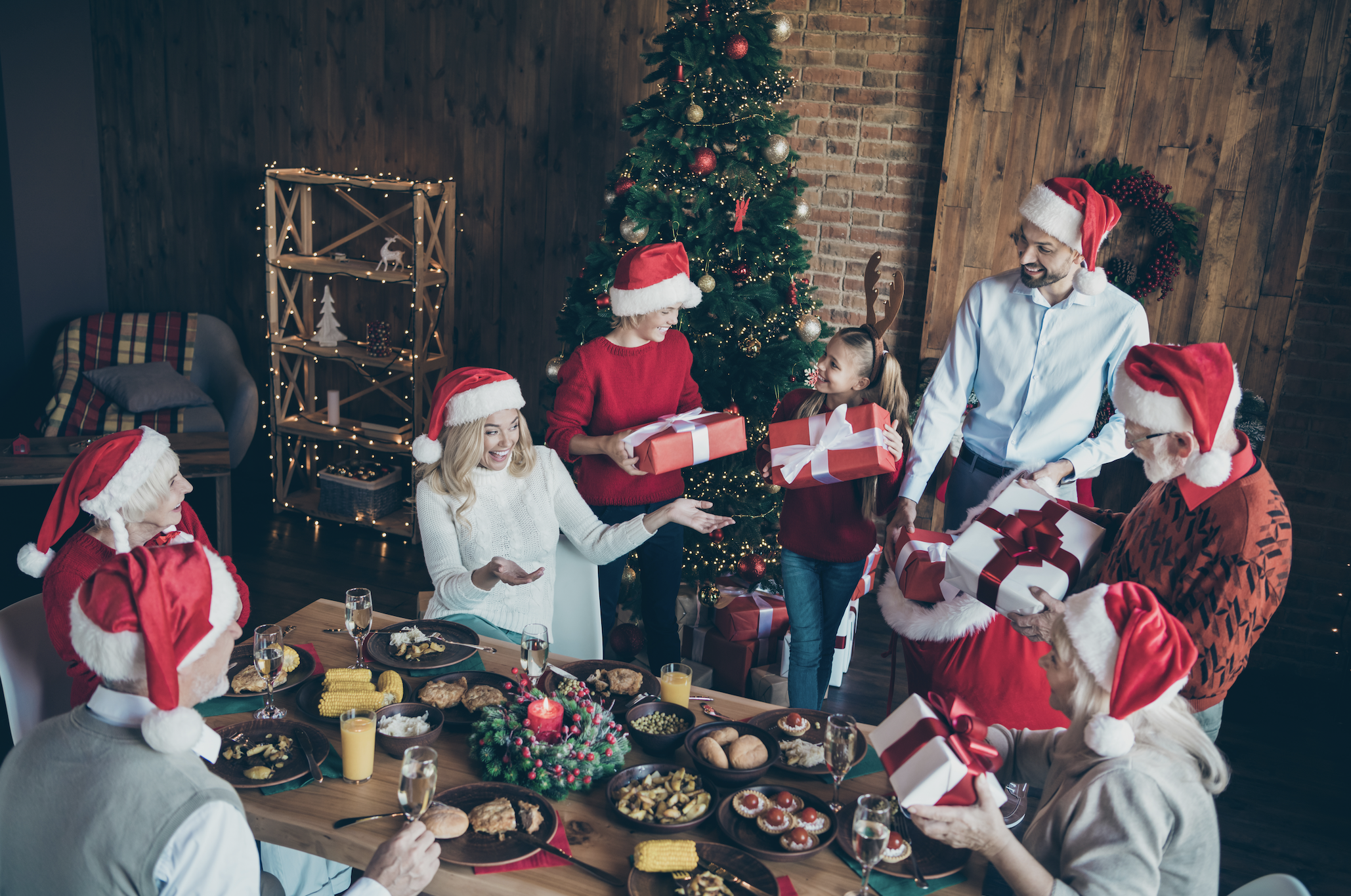 People exchange Christmas gifts | Source: Shutterstock