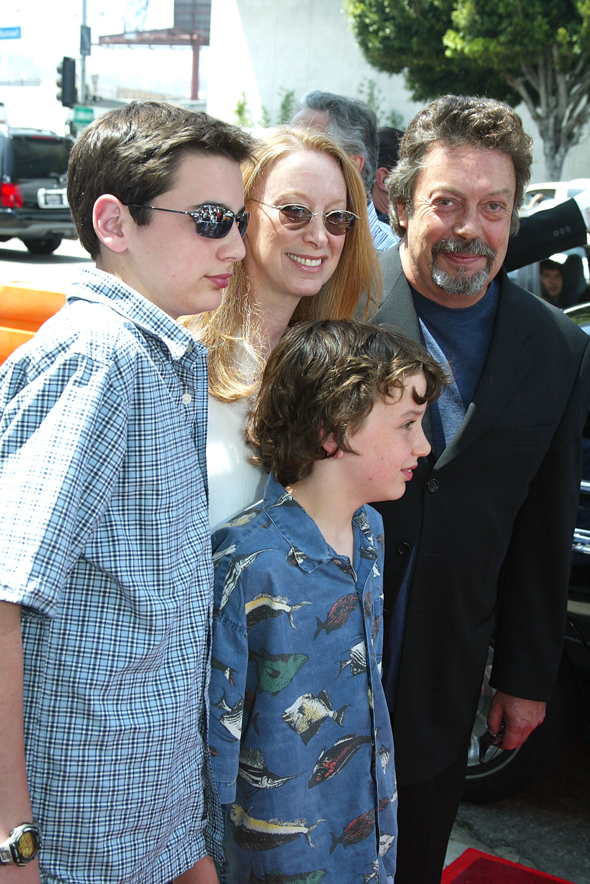 Actor Tim Curry (R) and his family arrive at the premiere and after-party for "Rugrats Go Wild" at the Cinerama Dome on June 1, 2003 in Los Angeles, California | Source: Getty Images