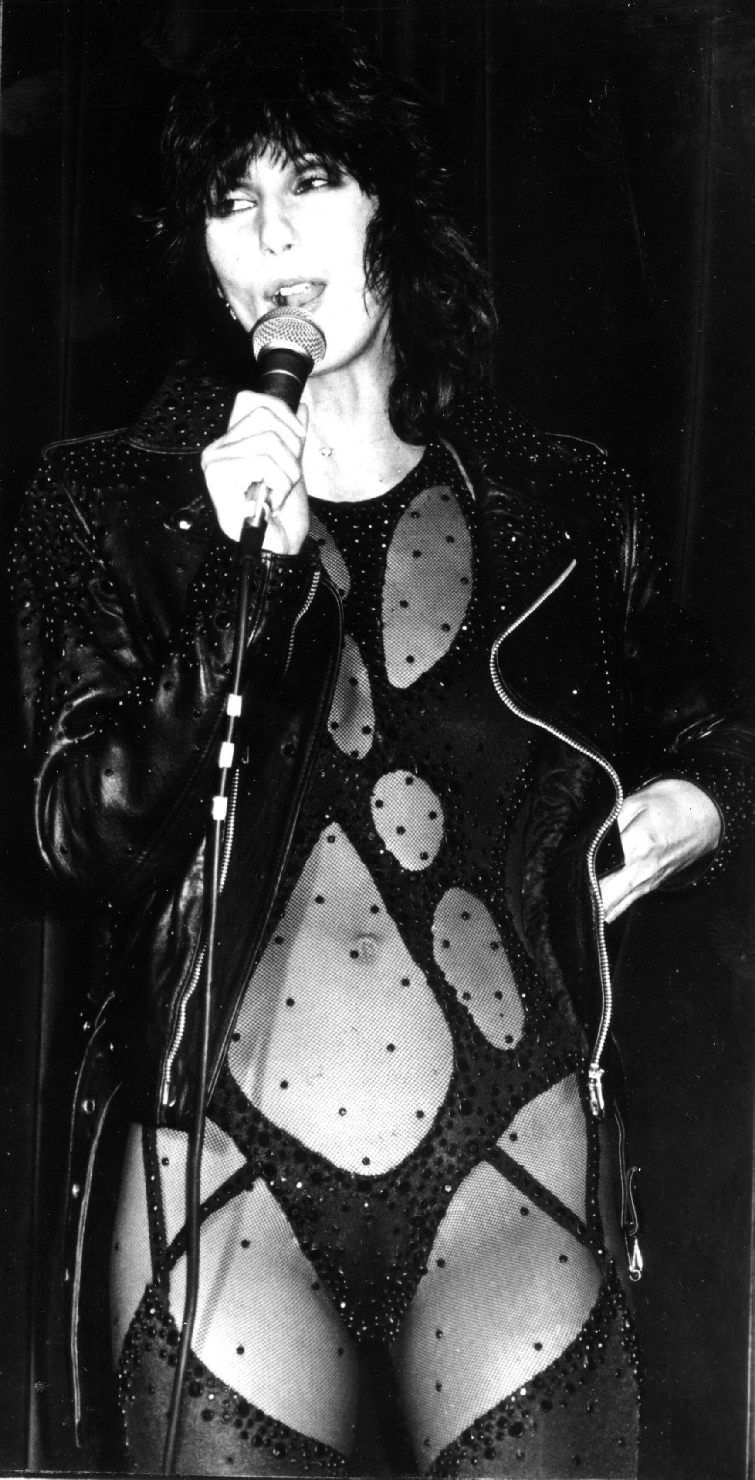 Cher performing "If I Could Turn Back Time" on the battleship USS Missouri on July 1, 1989, in Long Beach, California. | Source: Getty Images