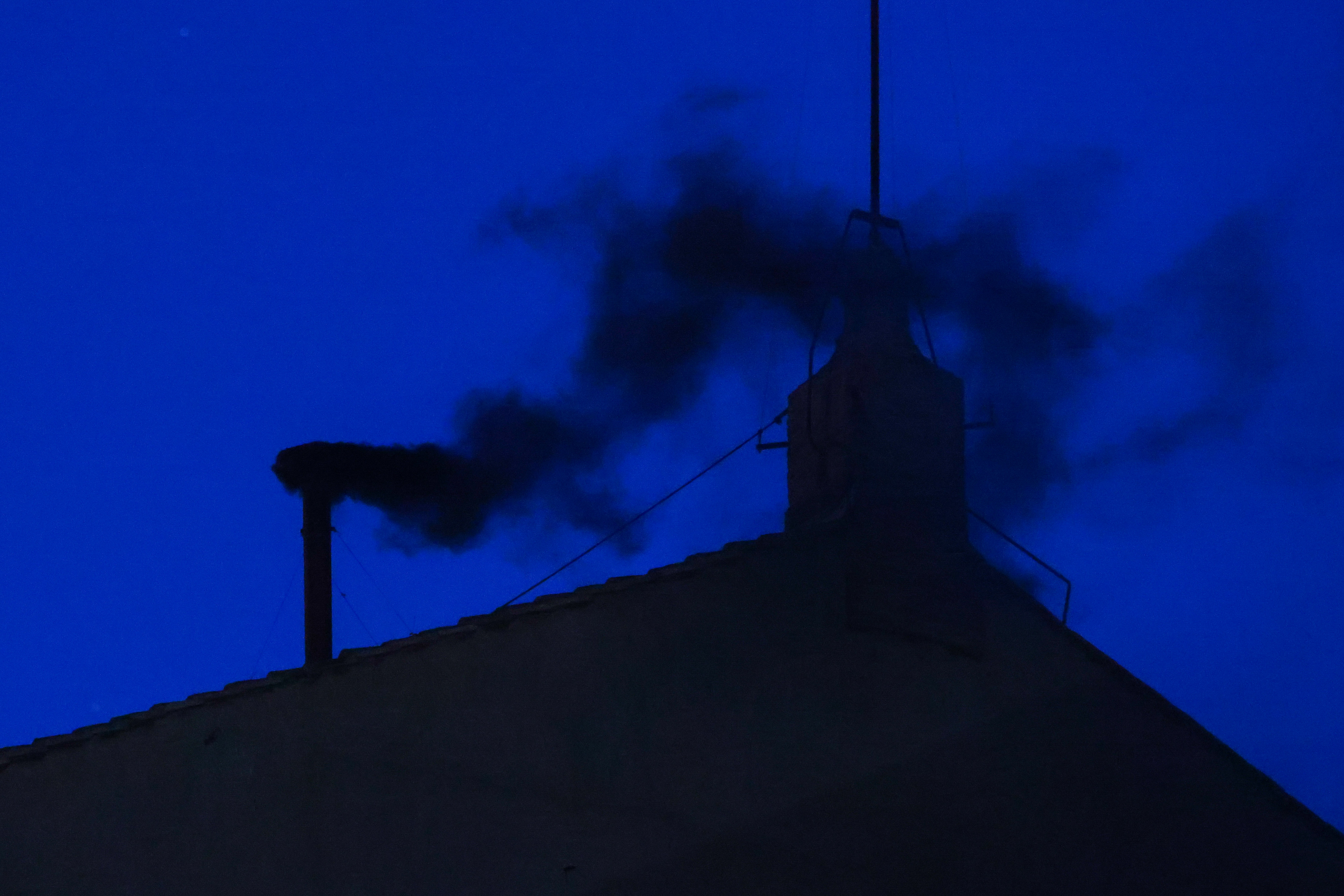 Black smoke is rising from the Sistine Chapel's chimney in Vatican City, on May 7, 2025 | Source: Getty Images