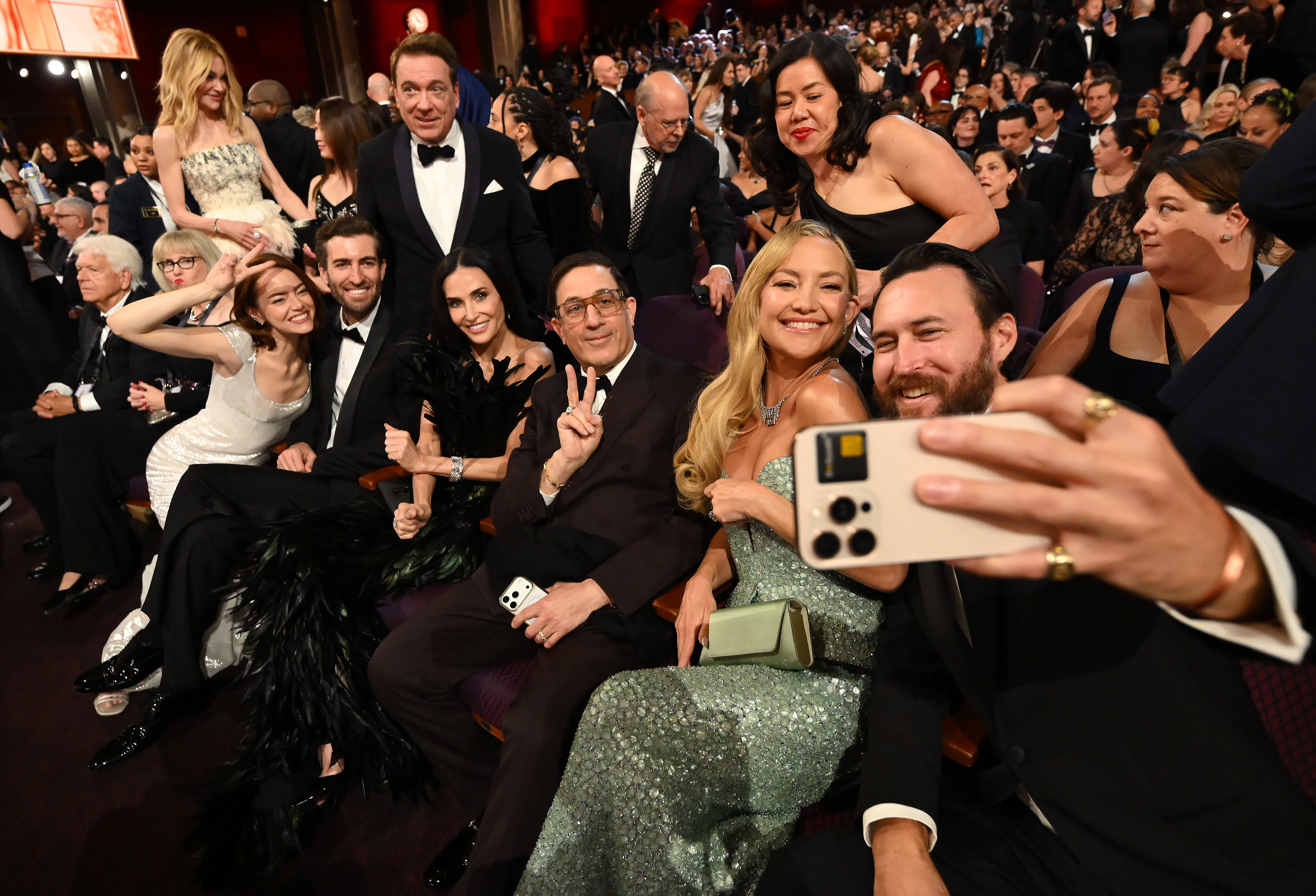 Emma Stone, Dave McCary, Demi Moore, Kate Hudson, and Danny Fujikawa pose for a selfie | Source: Getty Images