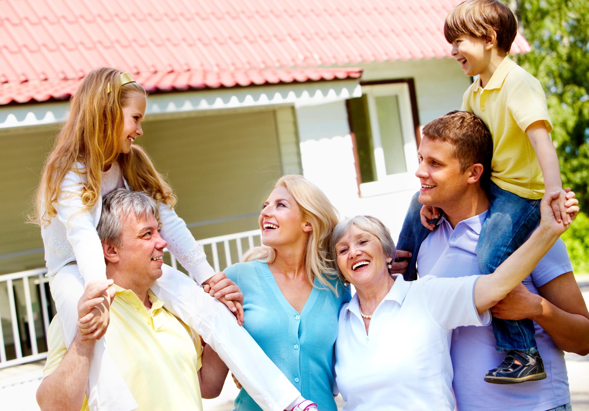 Grandparents with their children and grandchildren enjoying a happy moment | Source: Shutterstock