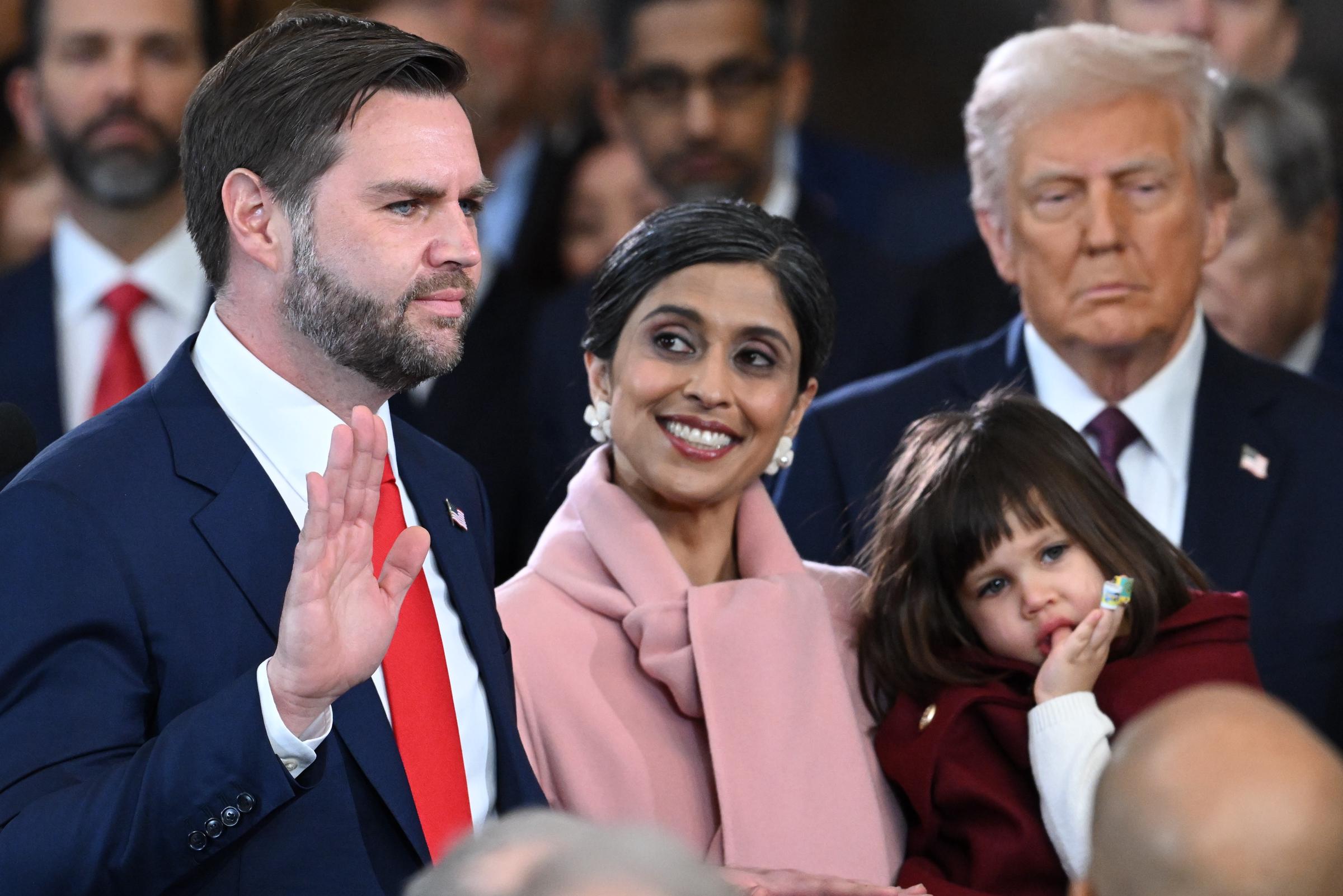 J.D. Vance is sworn in as U.S. Vice President alongside his wife, Usha, and family, while President Donald Trump looks on | Source: Getty Images