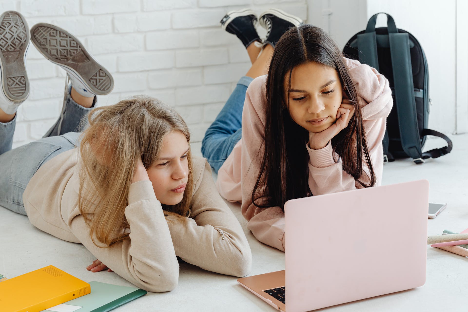 Two young girls using a laptop | Source: Pexels