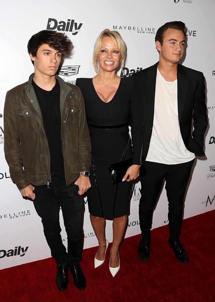 Pamela Anderson and her sons Brandon Thomas Lee (R) and Dylan Jagger Lee at the Fashion Los Angeles Awards on March 20, 2016, in West Hollywood, California | Photo: Frederick M. Brown/Getty Images