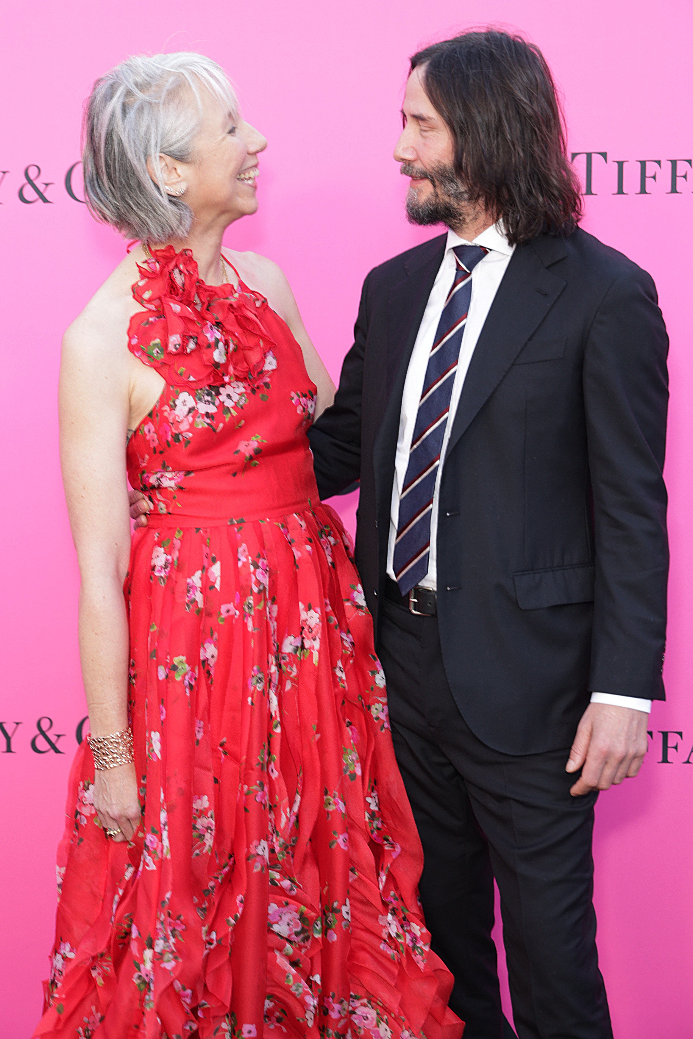 Alexandra Grant and Keanu Reeves smiling at each other at the MOCA Gala in Los Angeles, California on April 15, 2023. | Source: Getty Images
